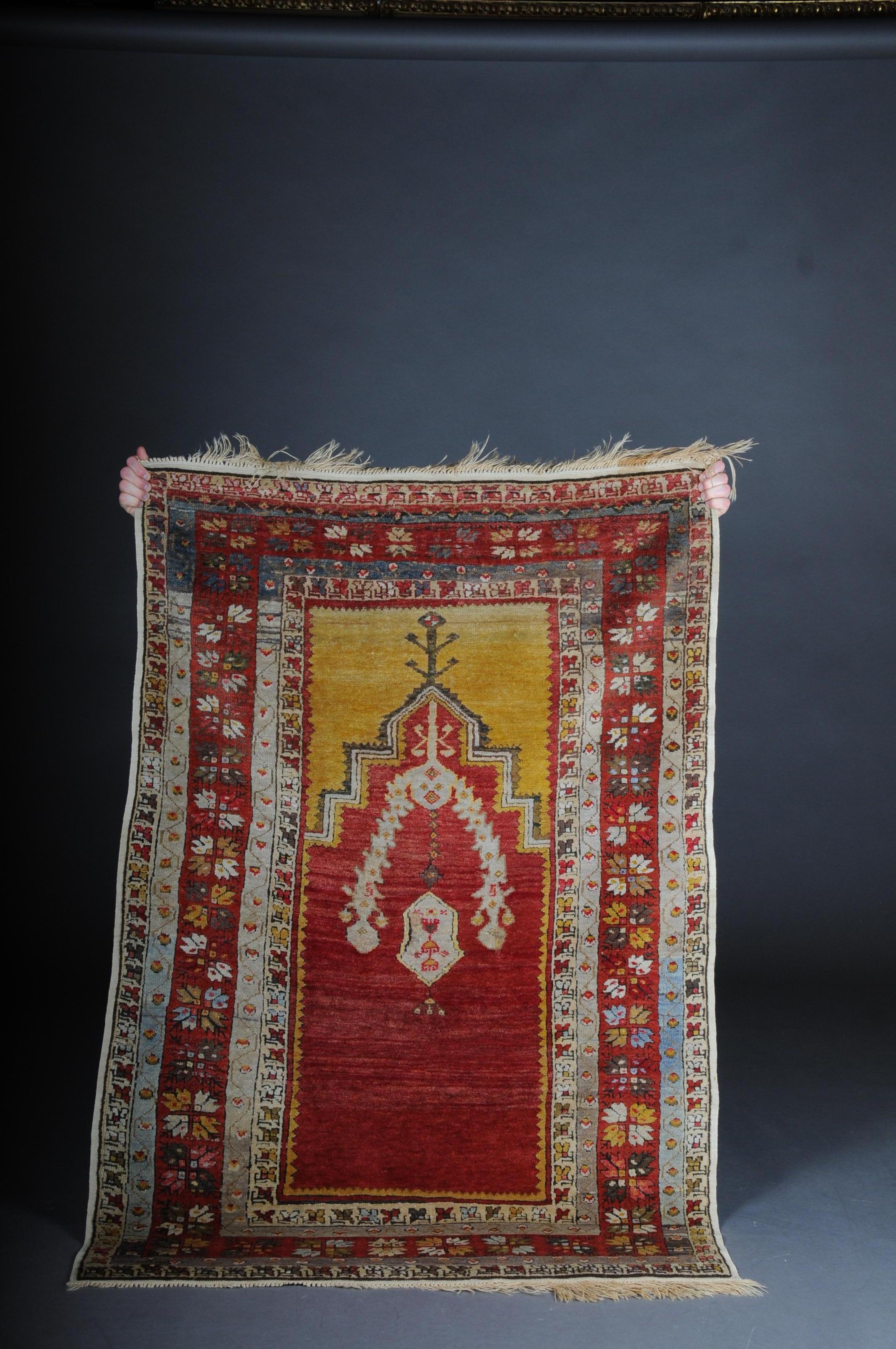 Antique Anatolian Konya prayer bridge / carpet from circa 1920

Anatolian double niche carpet. Red background, stepped mihrab is crowned by a beautiful, rich yellow niche and a panel with arrow-like ornaments.
Very good condition of the wool.