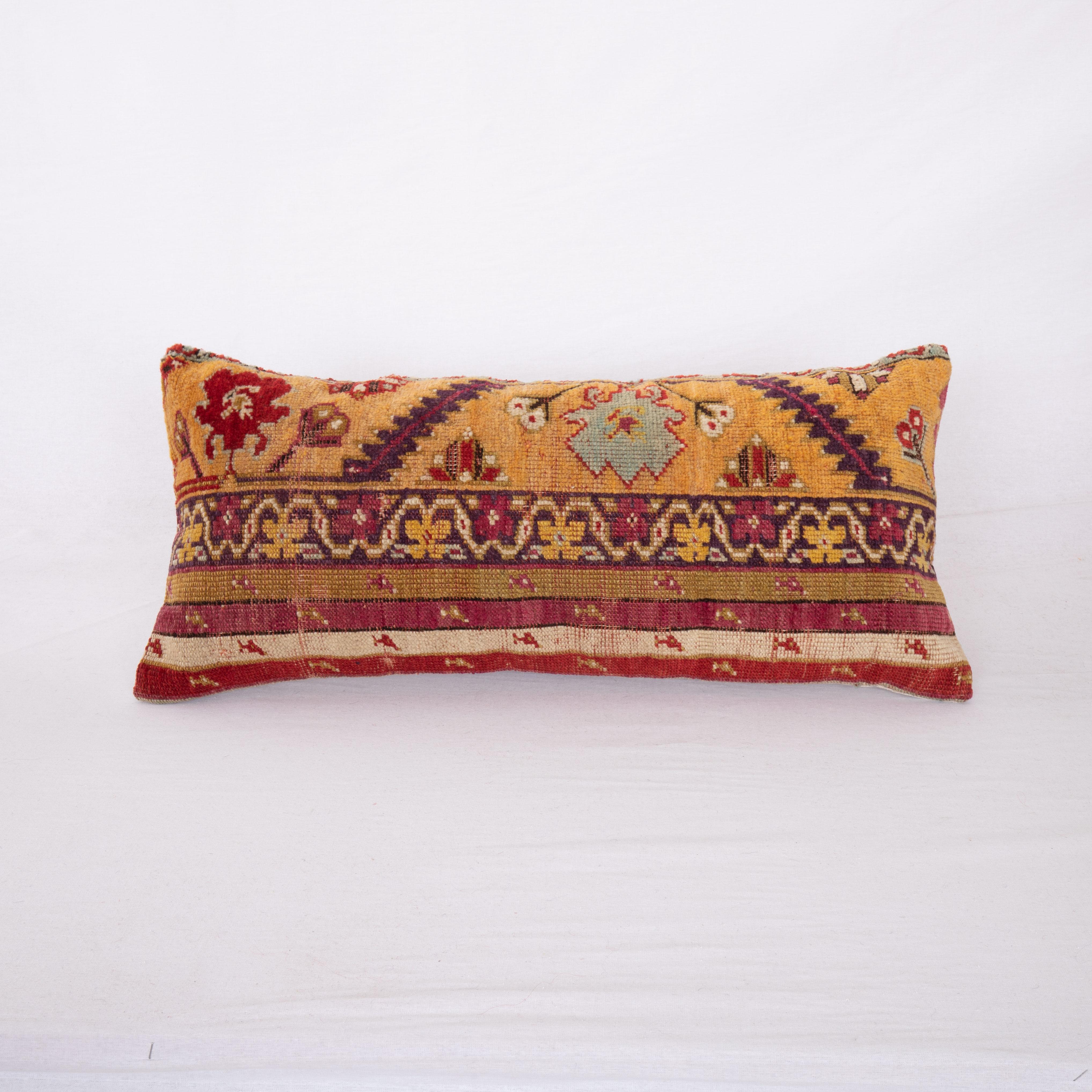 This pillow cover is made from an antique 19th C. Central Anatolian, Kirsehir rug fragment.

It does not come with an insert.
Linen in the back.
Zipper closure.
Dry Cleaning is recommended.