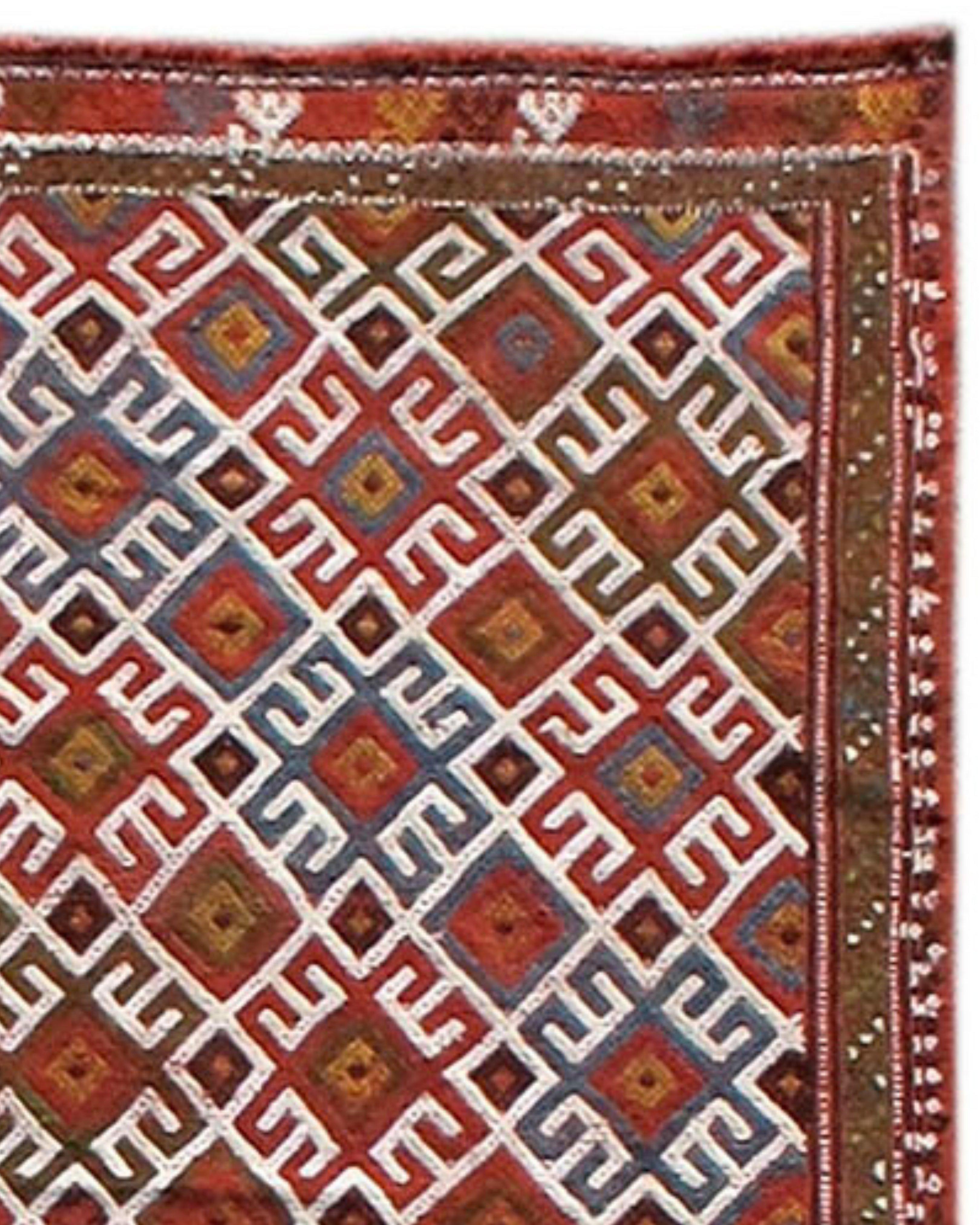 Antique Anatolian Verneh Flatweave Rug, 19th Century

With its alternation of boxes and latch-hook diamonds highlighted by alternating diagonal rows of color on an ivory ground, this flat-woven Anatolian Verneh achieves an “eye-dazzling” effect. Of