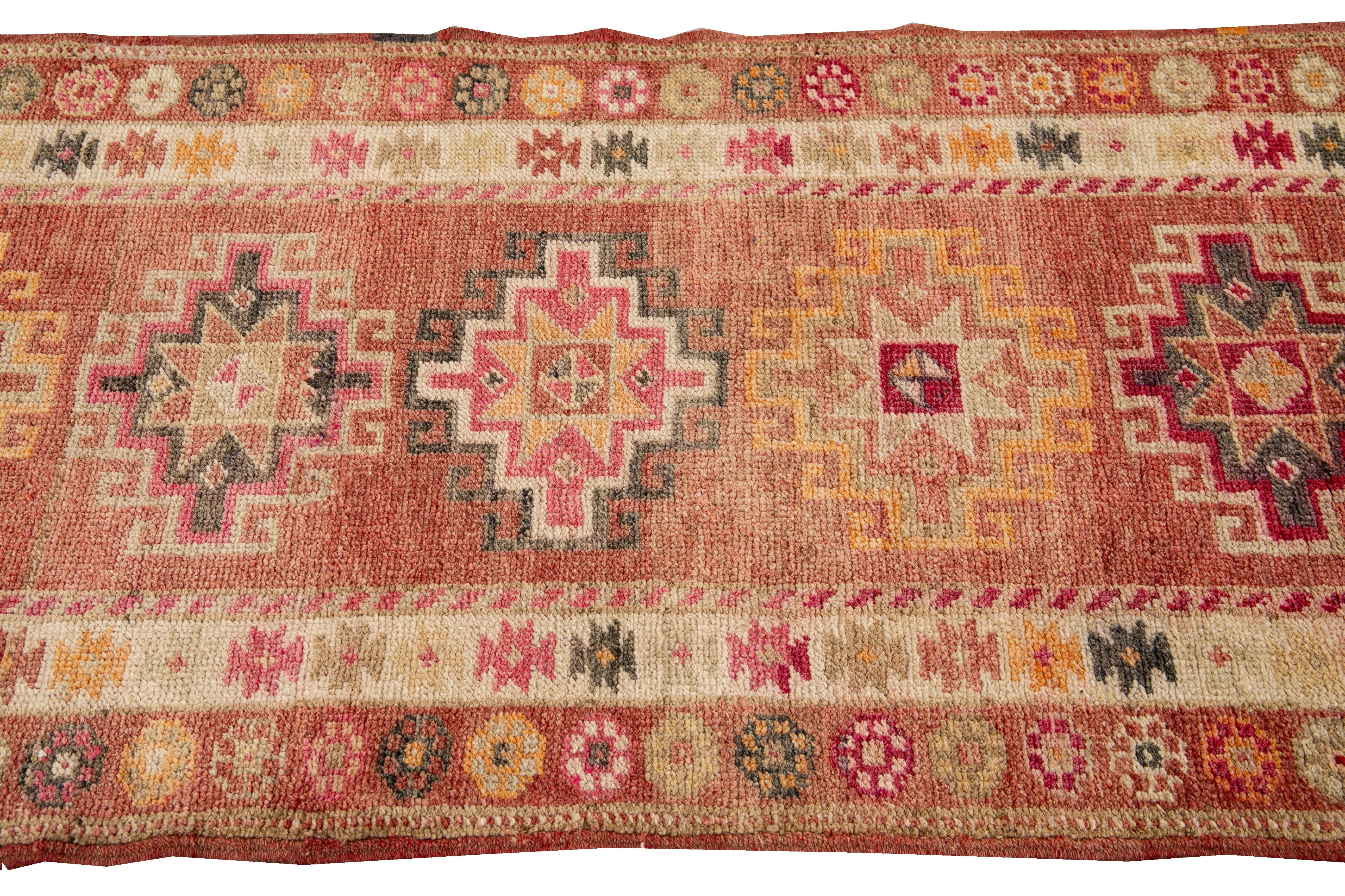 Hand-Knotted Antique Anatolian Village Handmade Medallion Designed Rusted Wool Runner For Sale