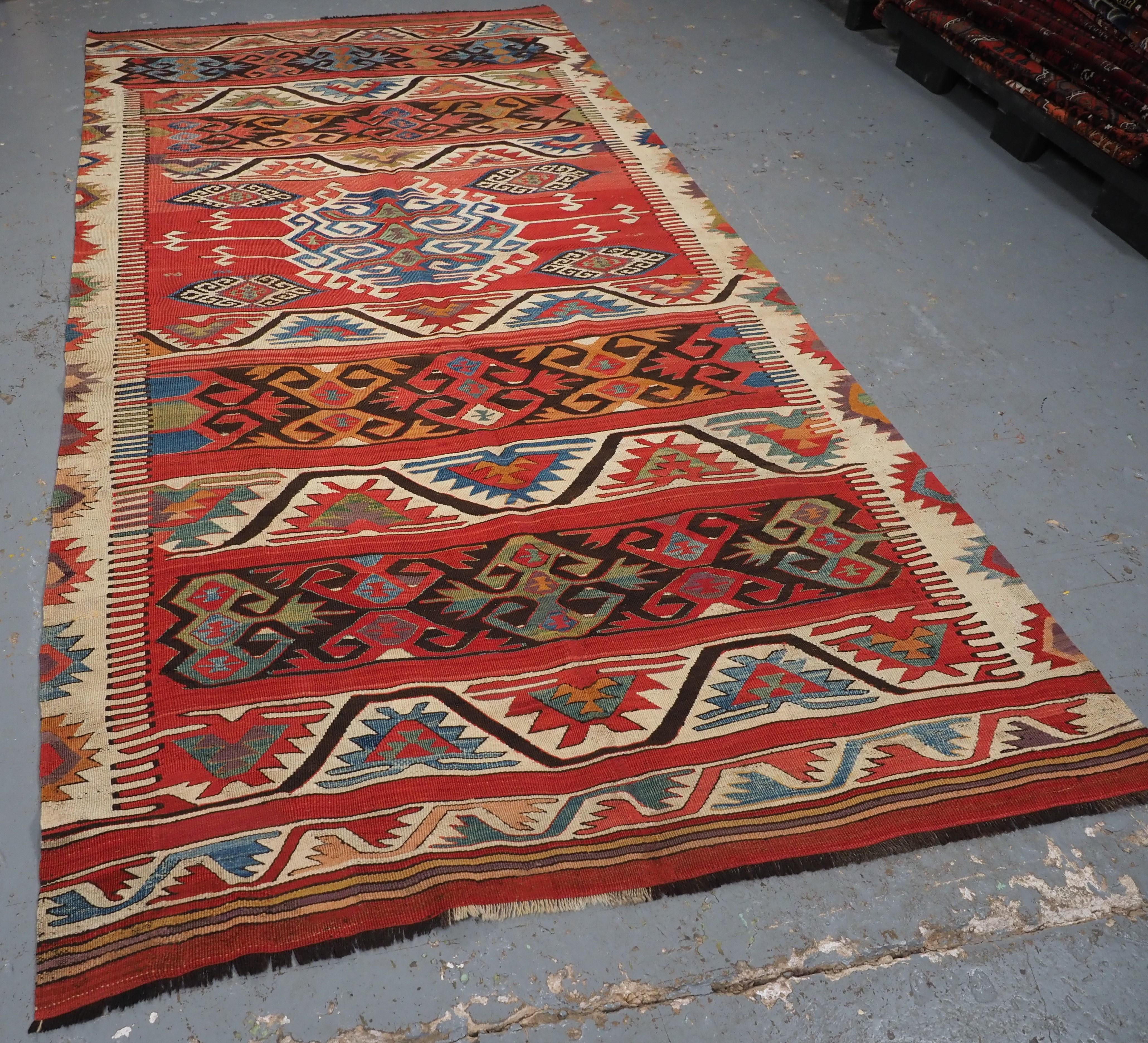 Size: 9ft 4in x 4ft 9in (285 x 146cm).

Antique Anatolian village kilim from the Mut region of South West Turkey, Taurus Mountains.

Circa 1880 or earlier.

This outstanding kilim is beautifully woven with a wonderful range of colours including soft