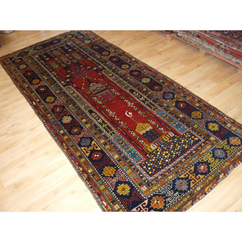 Antique Anatolian Yahyali village rug with scarce mosque design.

A very good example of this scarce design, the rug was probably woven for use in a mosque and shows views of both the inside and outside of the mosque.

The rug has excellent colour