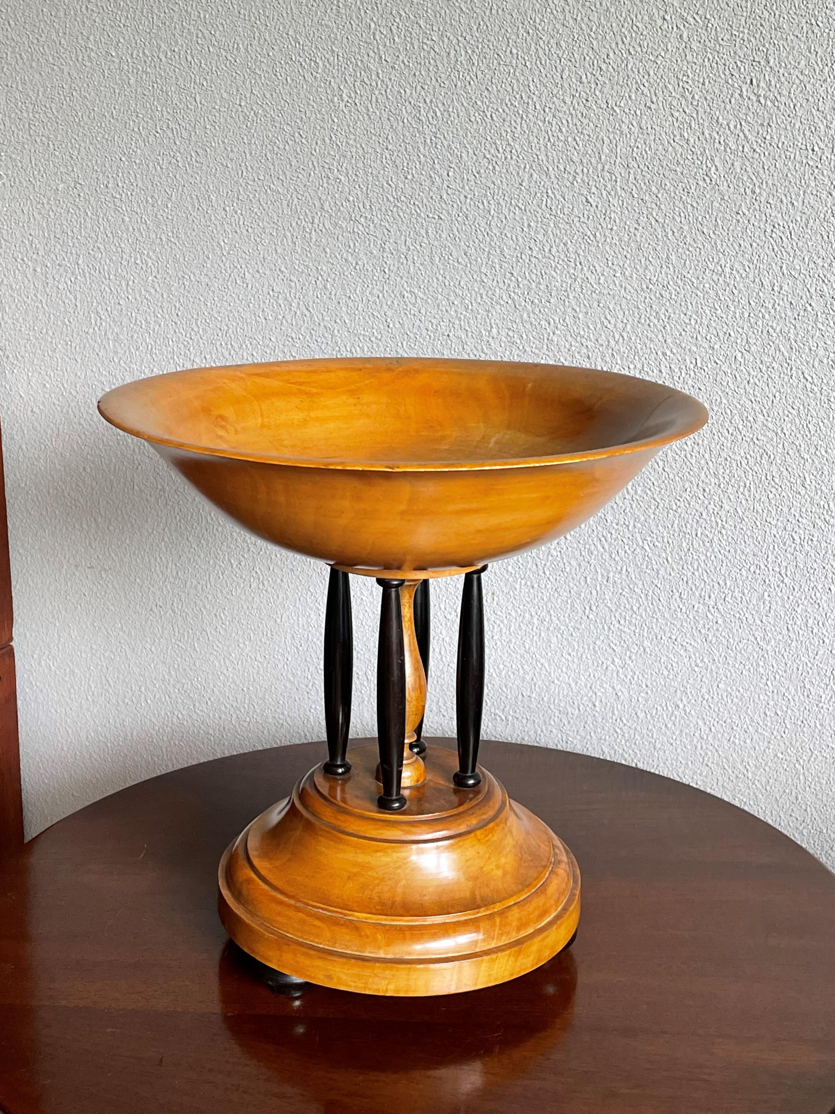 Very rare and easthetically pleasing antique wooden presentation piece.

We find it incredible that a piece that looks as fragile as this 19th century fruitbowl still is in such wonderful condition. In one spot inside the handcrafted wooden bowl it
