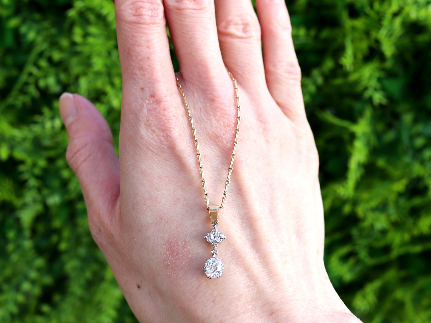 A fine and impressive antique and contemporary 0.91 carat diamond, 18 karat yellow gold and 18 karat white gold set pendant; part of our diverse antique diamond jewelry collections.

This fine and impressive diamond necklace has been crafted in 18k