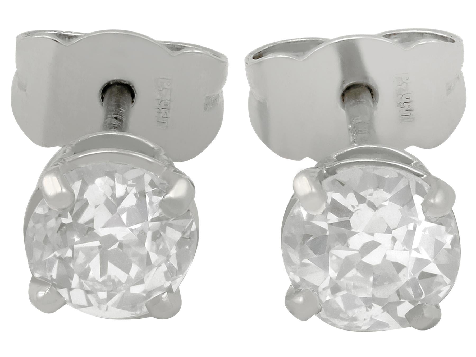 An impressive pair of antique 1900's 1.28 carat diamond and contemporary platinum stud earrings; part of our diverse diamond jewelry and estate jewelry collections.

These fine and impressive diamond stud earrings have been crafted in platinum.

The
