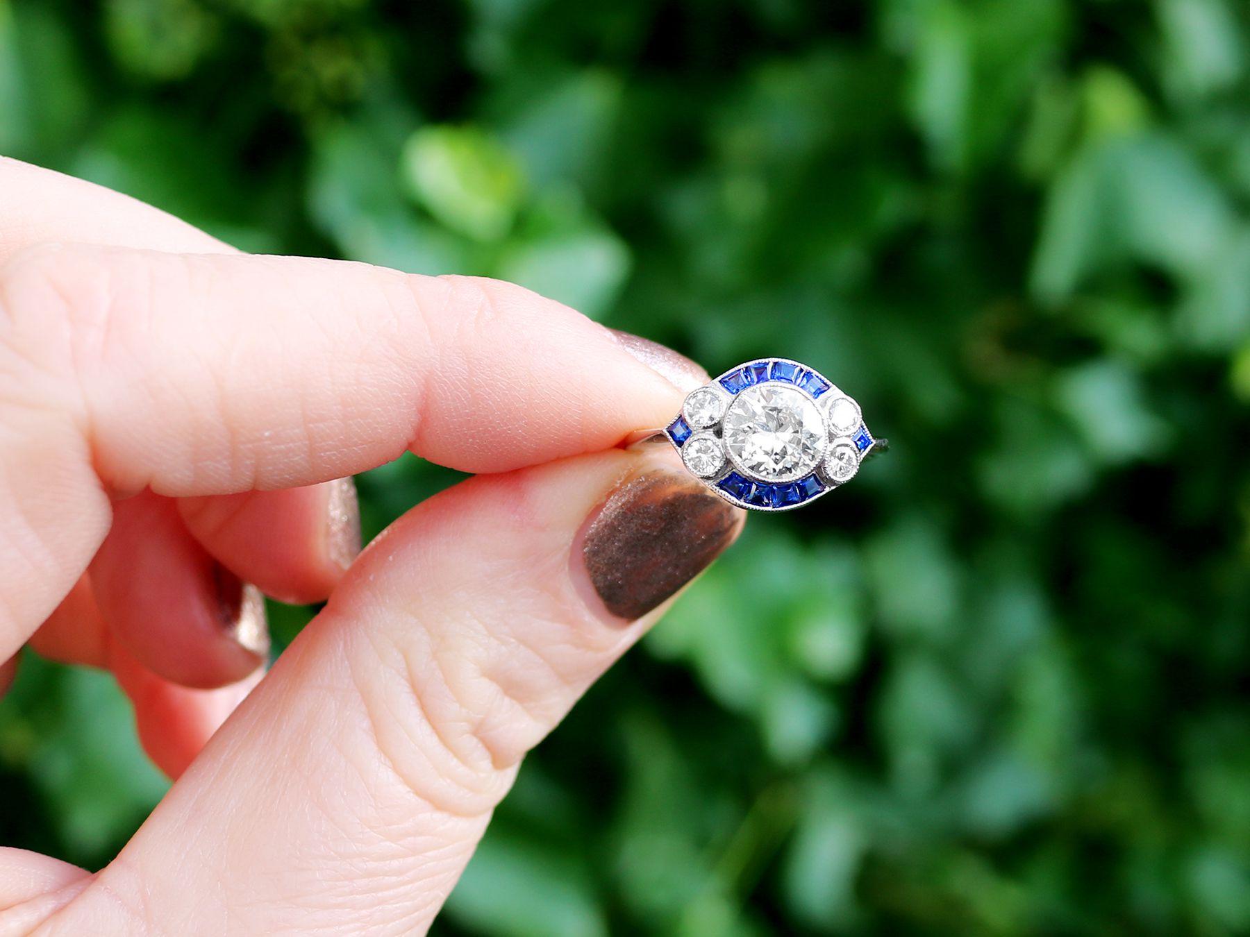 A stunning antique 1.48 carat diamond, contemporary 0.46 carat sapphire and platinum dress ring; part of our diverse gemstone jewelry and estate jewelry collections.

This stunning, fine and impressive antique sapphire ring has been crafted in