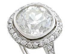 Antique and Contemporary 4.88 Carat Diamond and Platinum Halo Ring