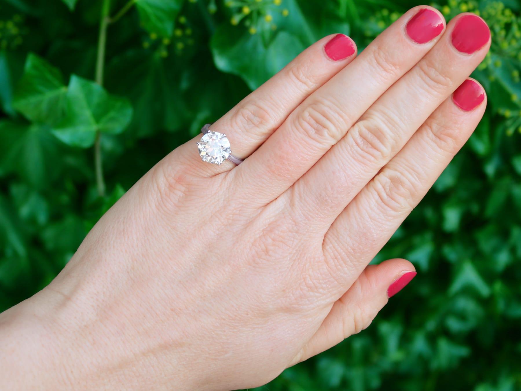 A stunning, fine and impressive antique 4.89 carat diamond solitaire engagement ring, displayed in a contemporary platinum setting; part of our diverse diamond jewellery collections.

This stunning, fine and impressive antique diamond solitaire