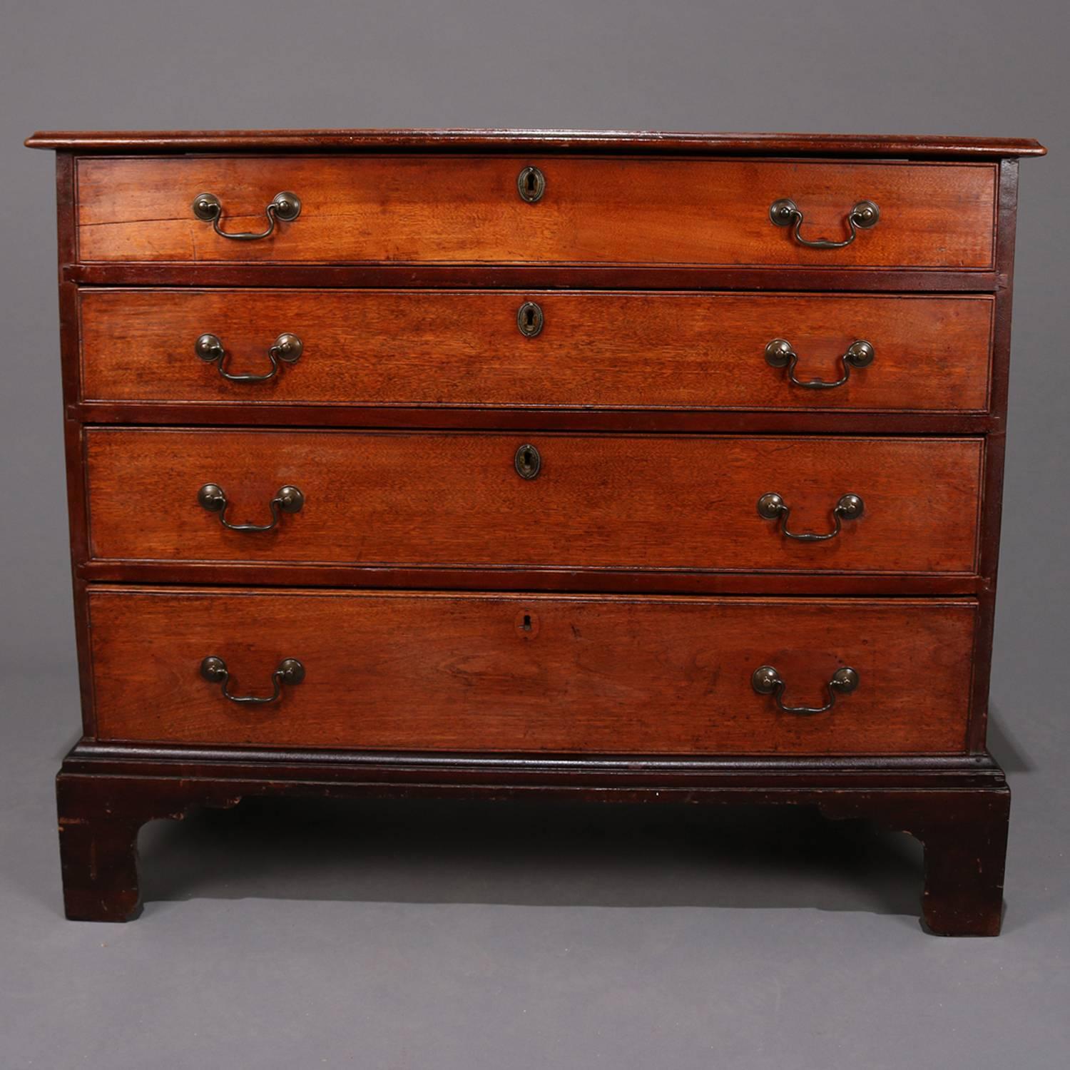 Antique and early English walnut Chippendale chest features case with four long drawers seated on dovetailed bracket feet, bronze pulls and escutcheons, 18th century.

Measures: 33.75