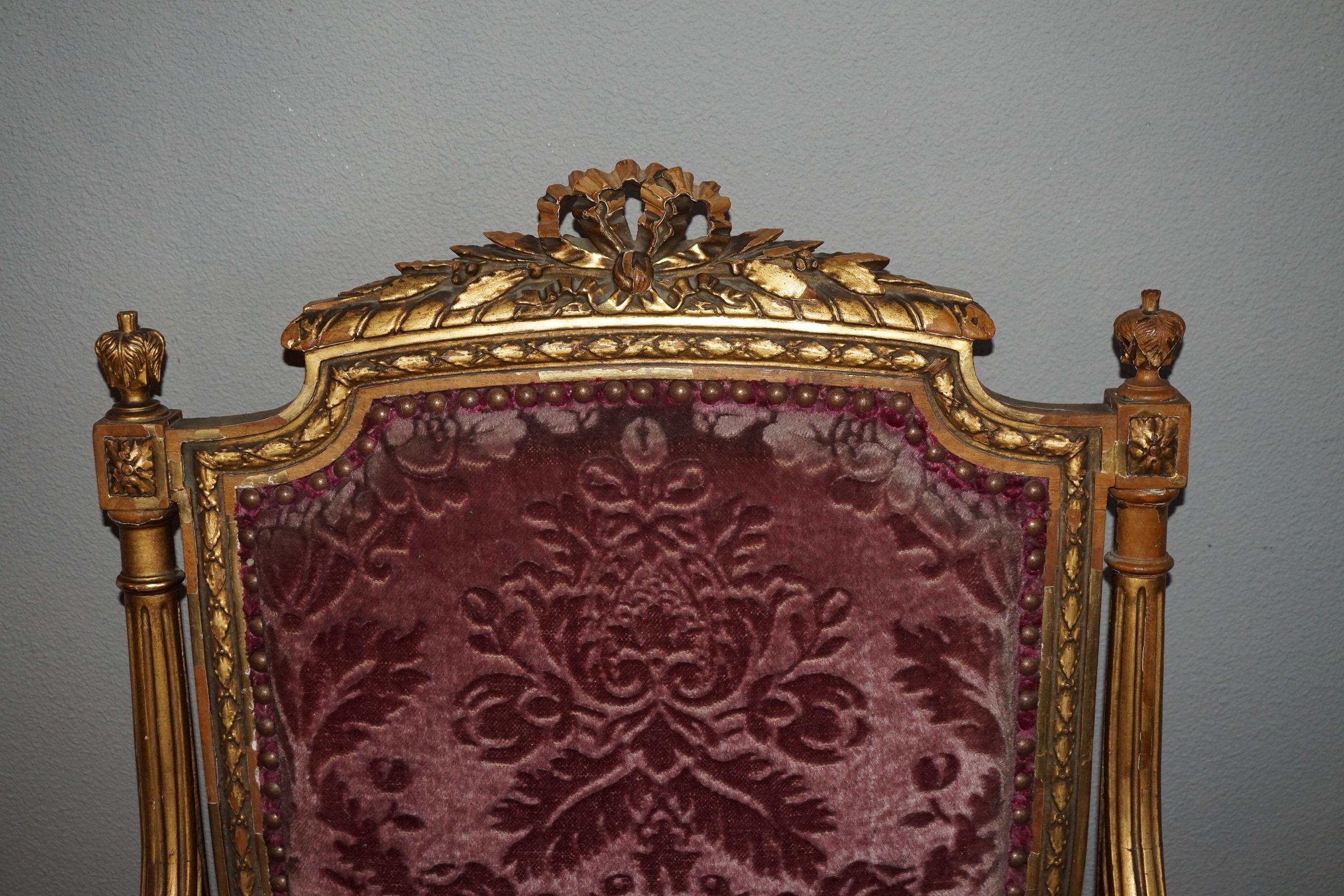 Rare and great quality carved chair.

This antique chair from the late 1800s is structurally as sound as can be and the details in the carved Louis Seize style elements are of very good quality. As you can see in our images, some of the gilding