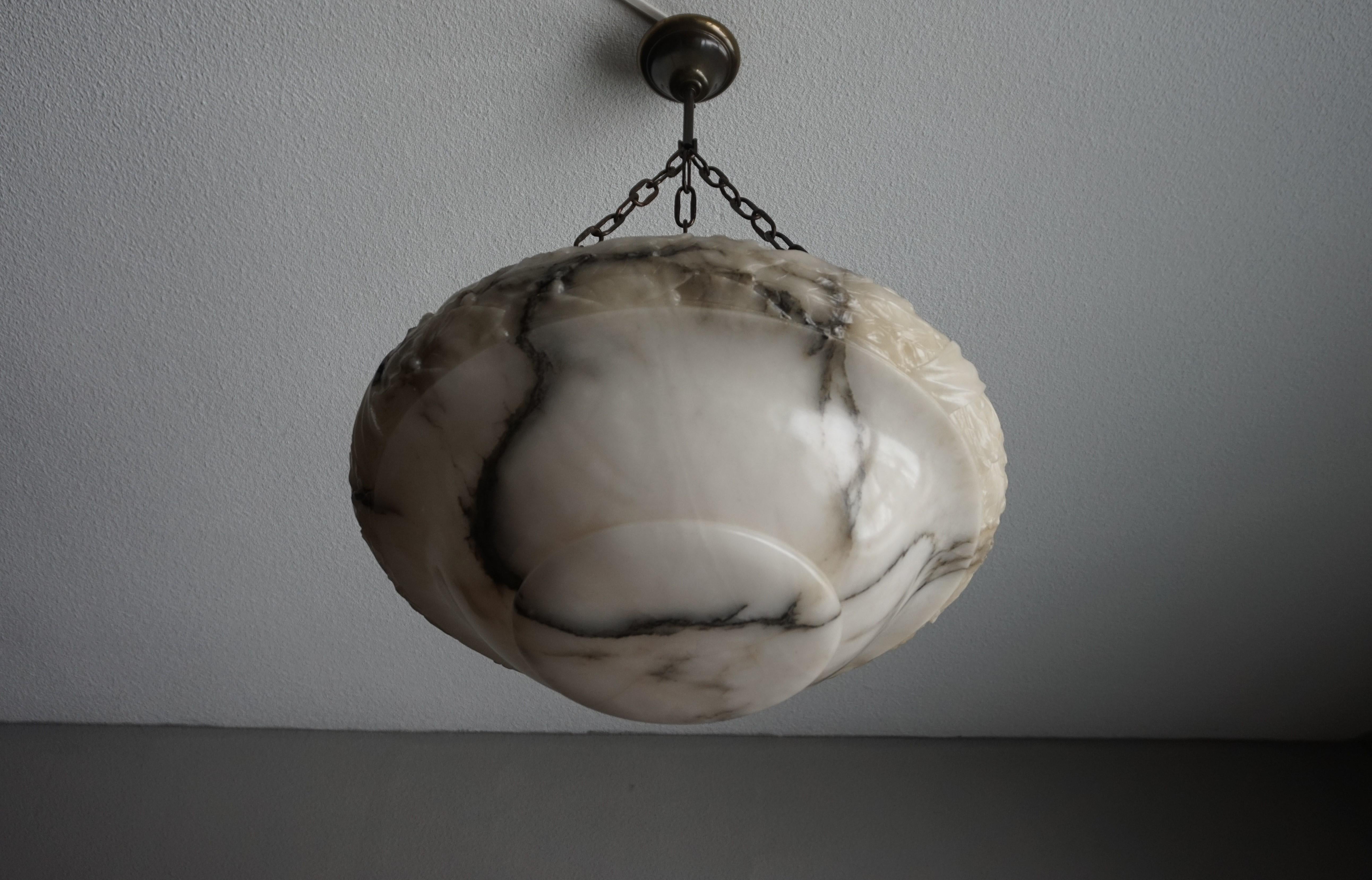 Large size and stunning, early 20th century craftsmanship chandelier.

We have one of the largest collections of antique light fixtures in Europe and probably the largest when it comes to good quality and ready to use alabaster pendants. Our lights