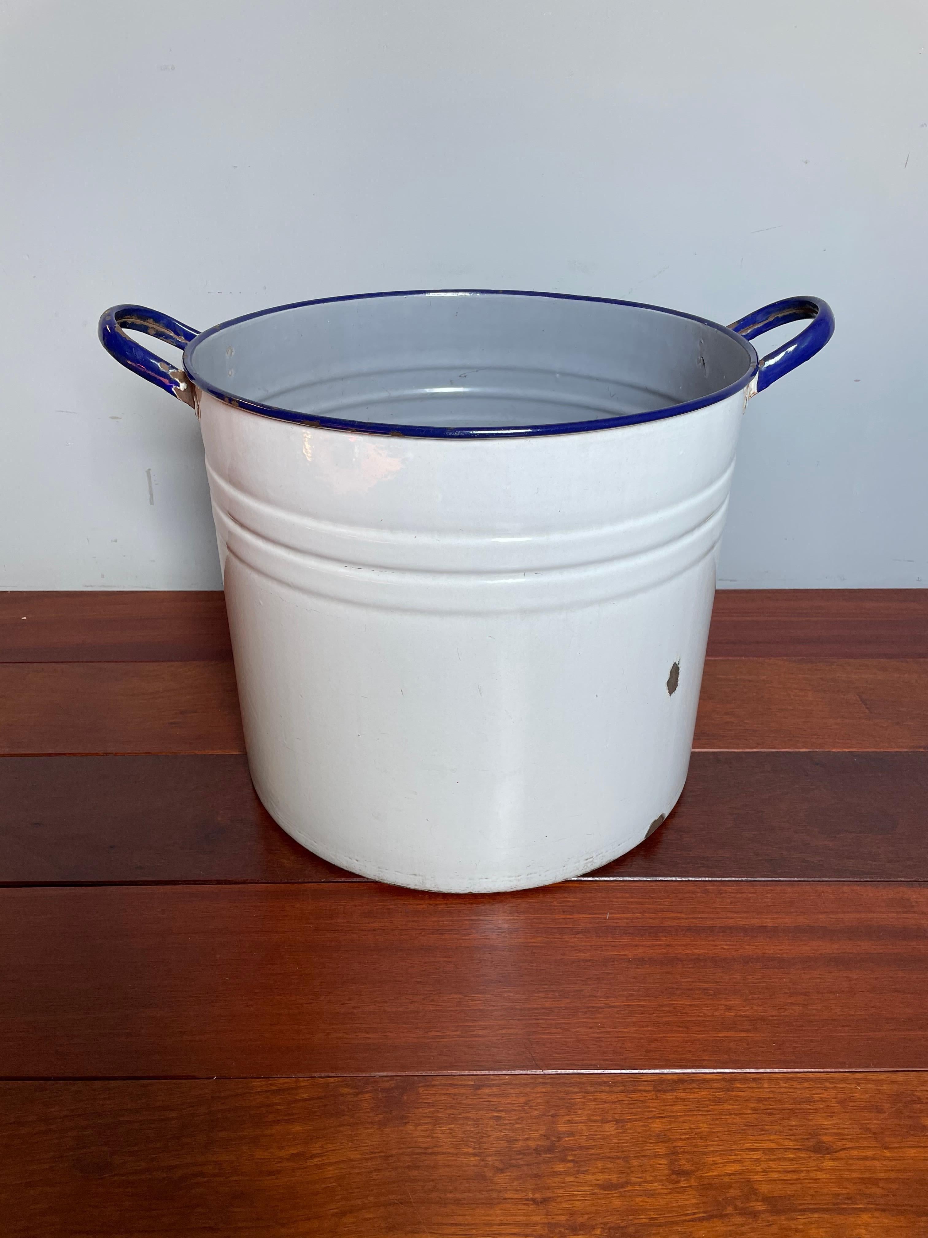 Great shape and rare colors, large enameled bucket with handles.

If you are looking for rare and stylish antiques to decorate your bathroom, laundry room or garden then this handcrafted and large 'tub' could be perfect for you. This early twentieth