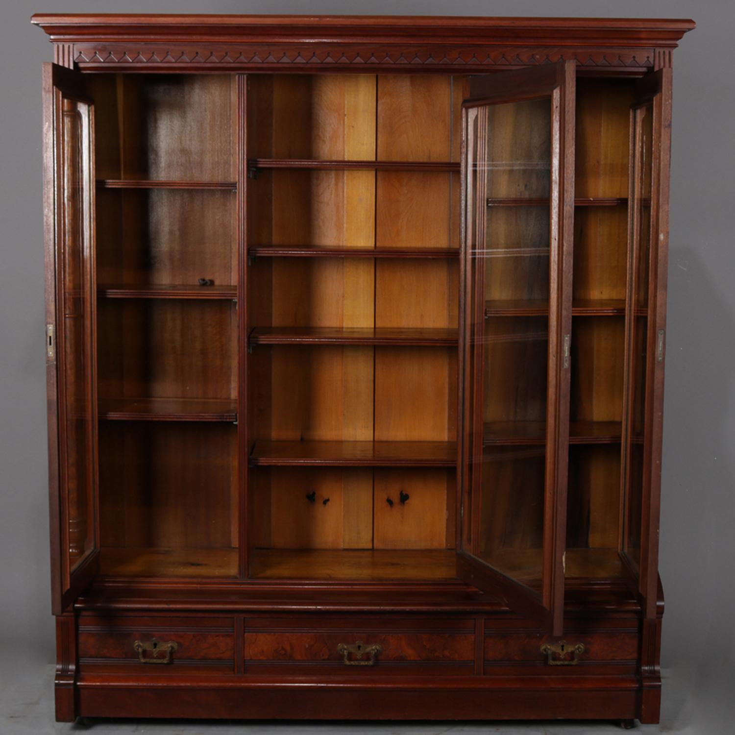 American Antique and Large Eastlake Carved Walnut and Burl 3-Door Executive Bookcase