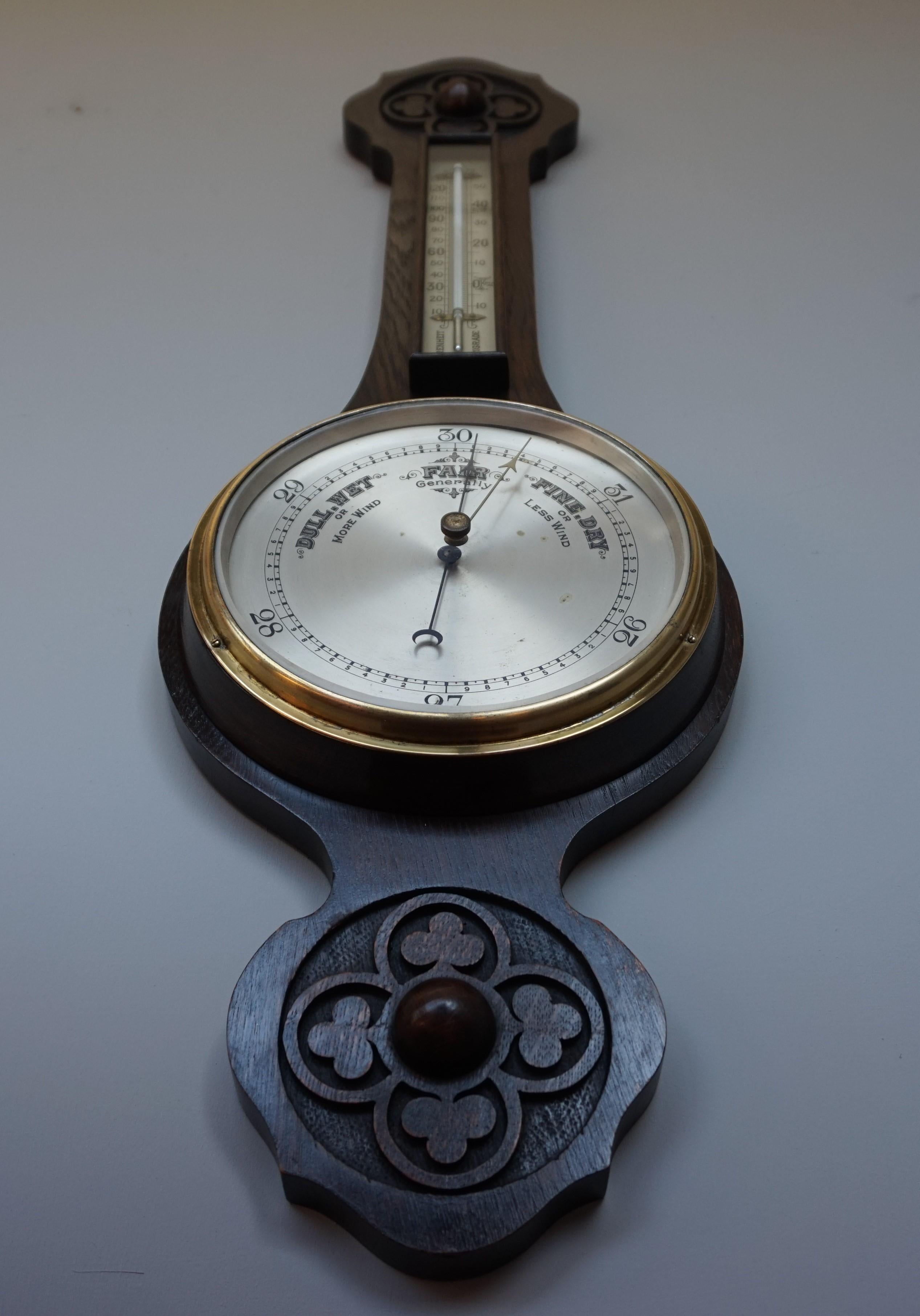 Calm and stylish Gothic Revival barometer with quatrefoil and trefoil carvings.

This stylish antique from the late 1800s is a minimalist's dream, because this Gothic design could not be more calm and classy. Both the hand carved, solid oak body of