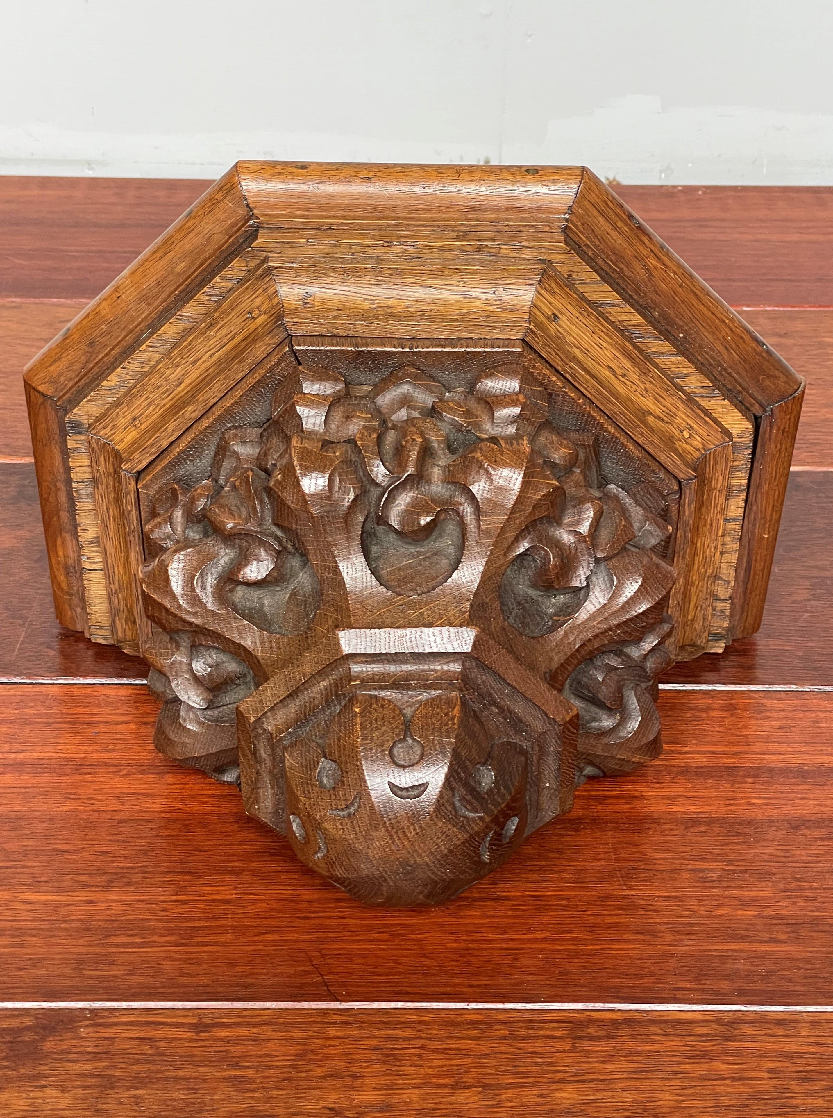 Wonderful and deeply carved Gothic Revival Bracket.

This all handcrafted, Gothic Revival wall bracket has the most wonderful shape and a striking patina. The organic shape and the natural flowing lines of the deeply carved Gothic leaves are an