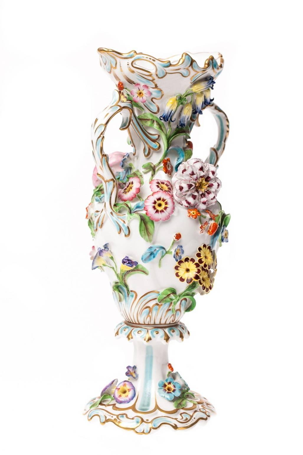 This antique vase is a most spectacularly beautiful floral encrusted mantle vase in the Rococo manner of Certified by the British Antique Dealer's Association, it bears their seal certifying the age of this superb vase as prior to 1849.