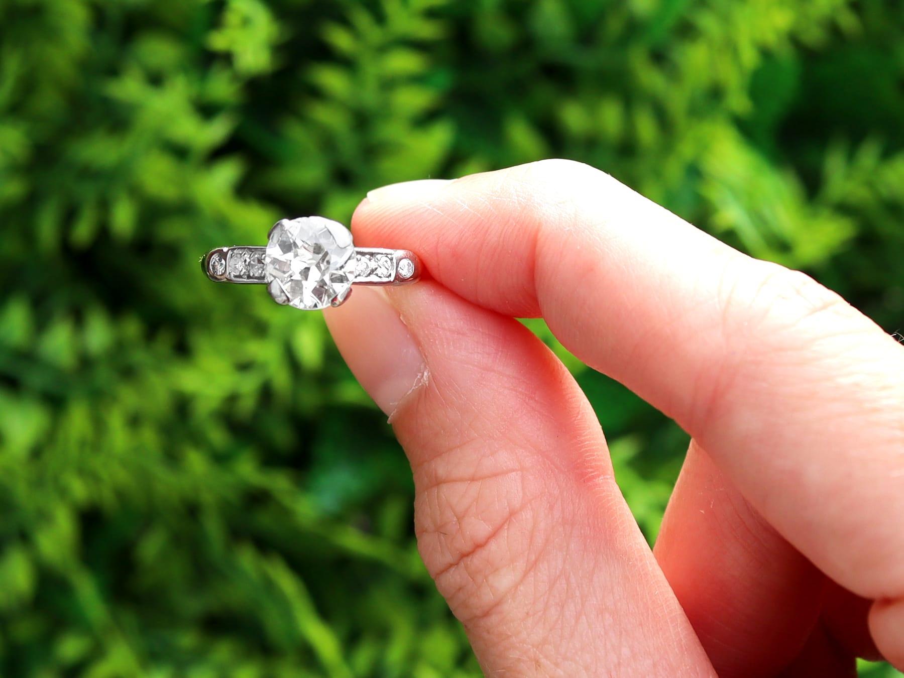 A stunning, fine and impressive antique and vintage 1.60 carat diamond, 14 karat yellow gold and platinum set solitaire ring; part of our diverse diamond jewelry and estate jewelry collections.

This stunning, fine and impressive vintage diamond