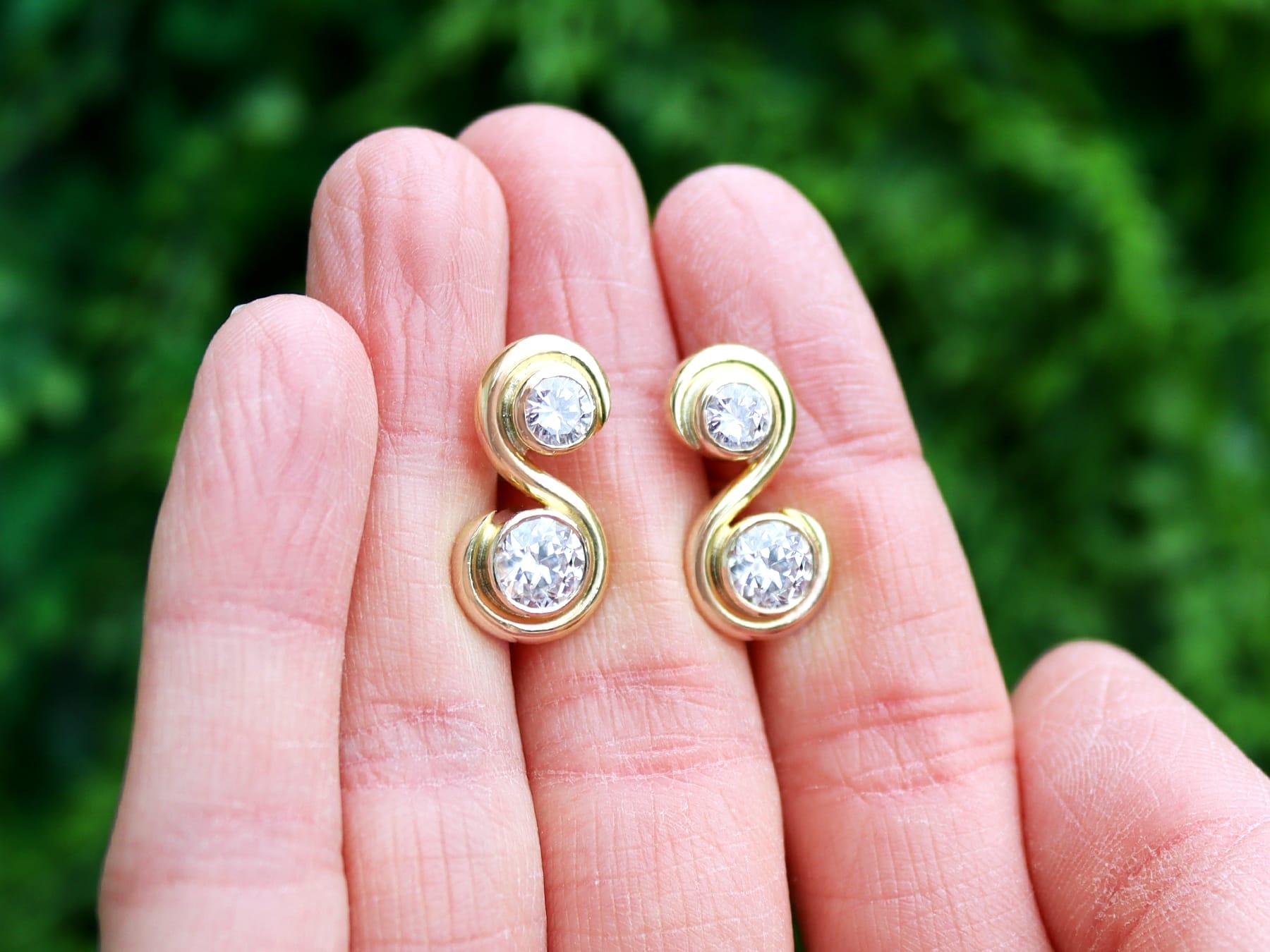 A stunning, fine and impressive pair of antique and vintage 2.48 carat diamond and 18 karat yellow gold earrings; part of our diamond jewelry collections.

These fine and impressive diamond earrings have been crafted in 18k yellow gold.

These