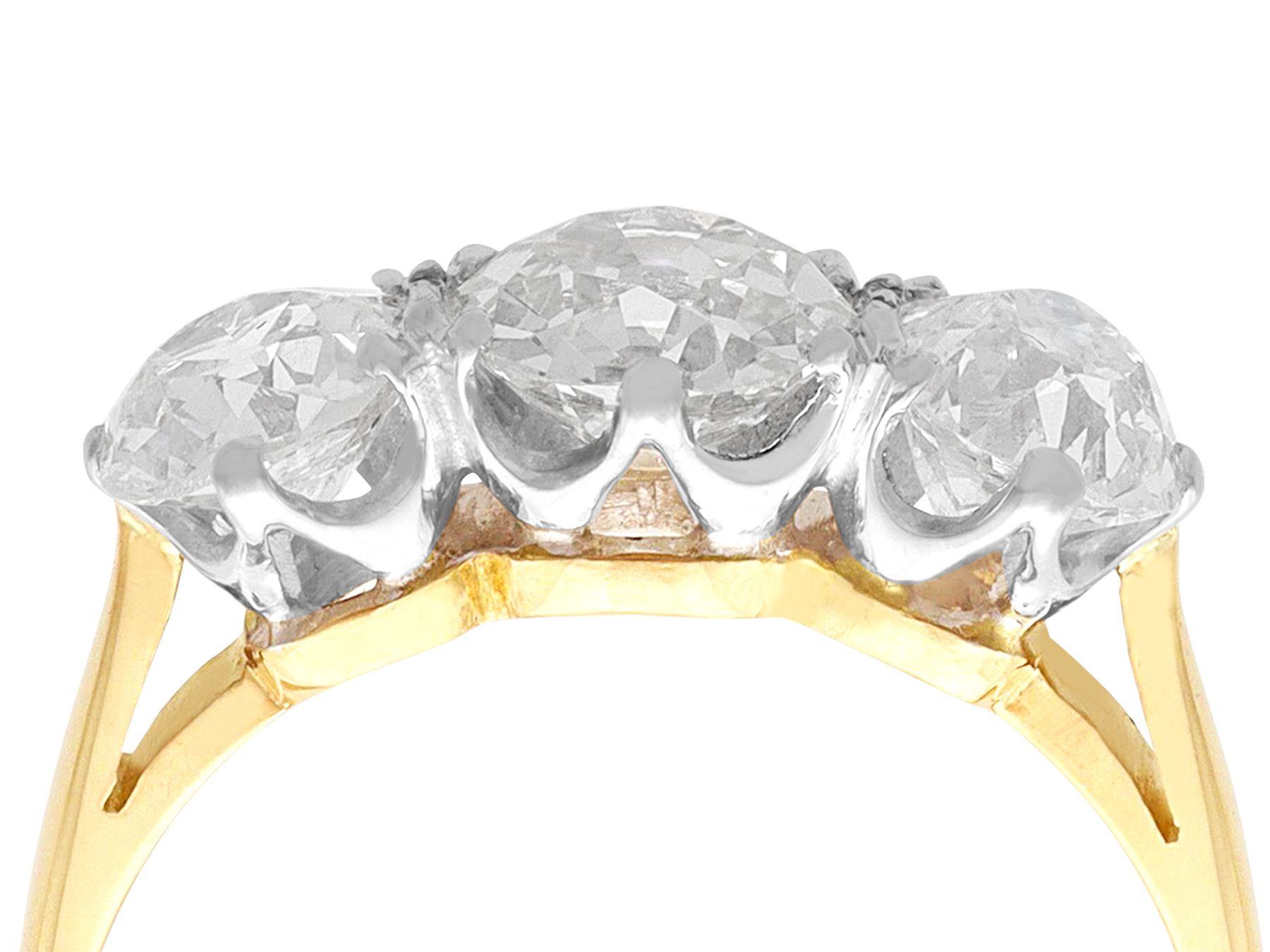 A stunning, fine and impressive 3.20 carat diamond, 18 karat yellow gold and 18 karat white gold trilogy ring; part of our diverse engagement ring collections.

This stunning three stone ring has been crafted in 18k yellow gold with an 18k white