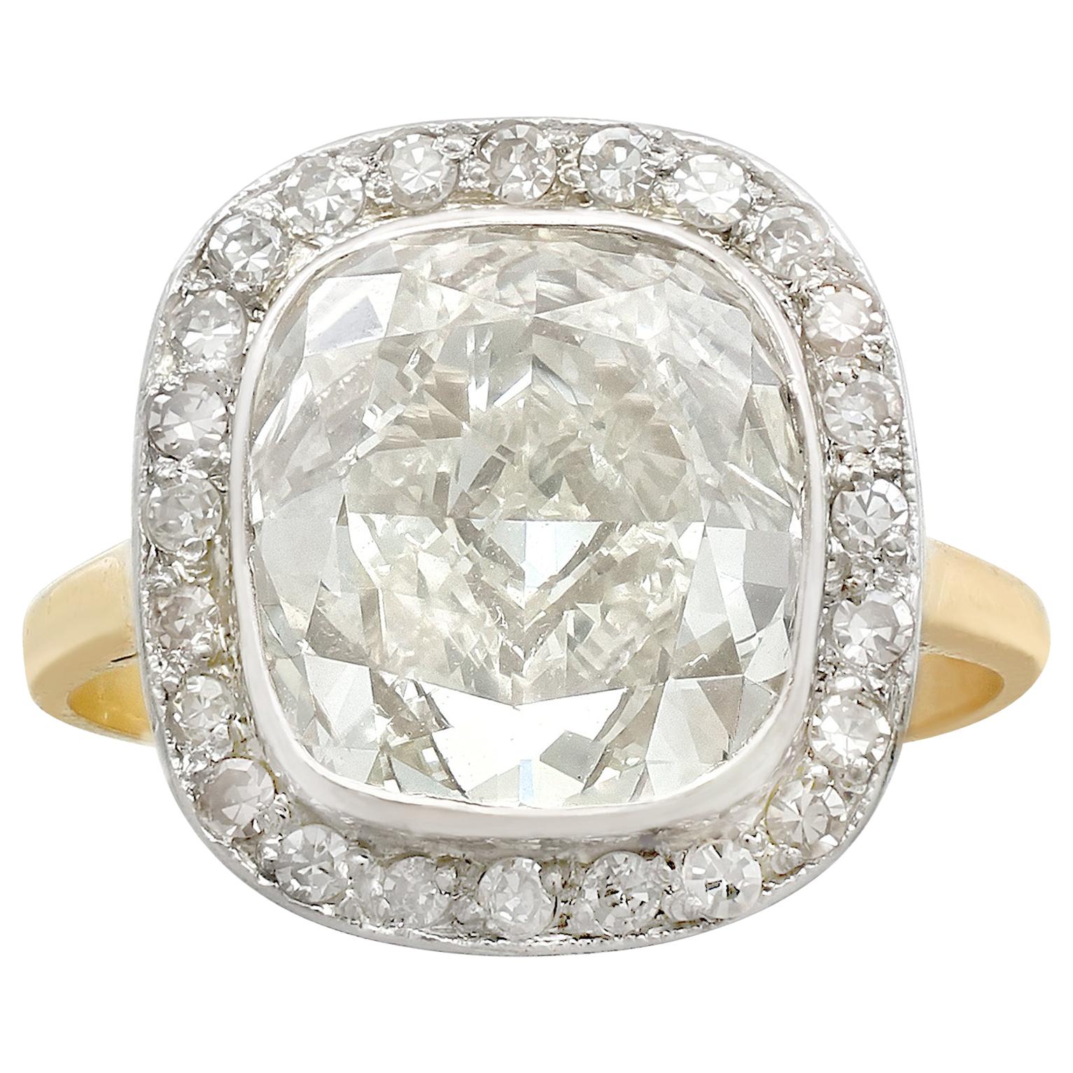 A stunning antique and vintage 5.73 carat diamond and 18 carat yellow gold, 10 carat white gold set engagement ring; part of our diverse diamond jewellery and estate jewelry collections.

This stunning, fine and impressive antique diamond halo ring