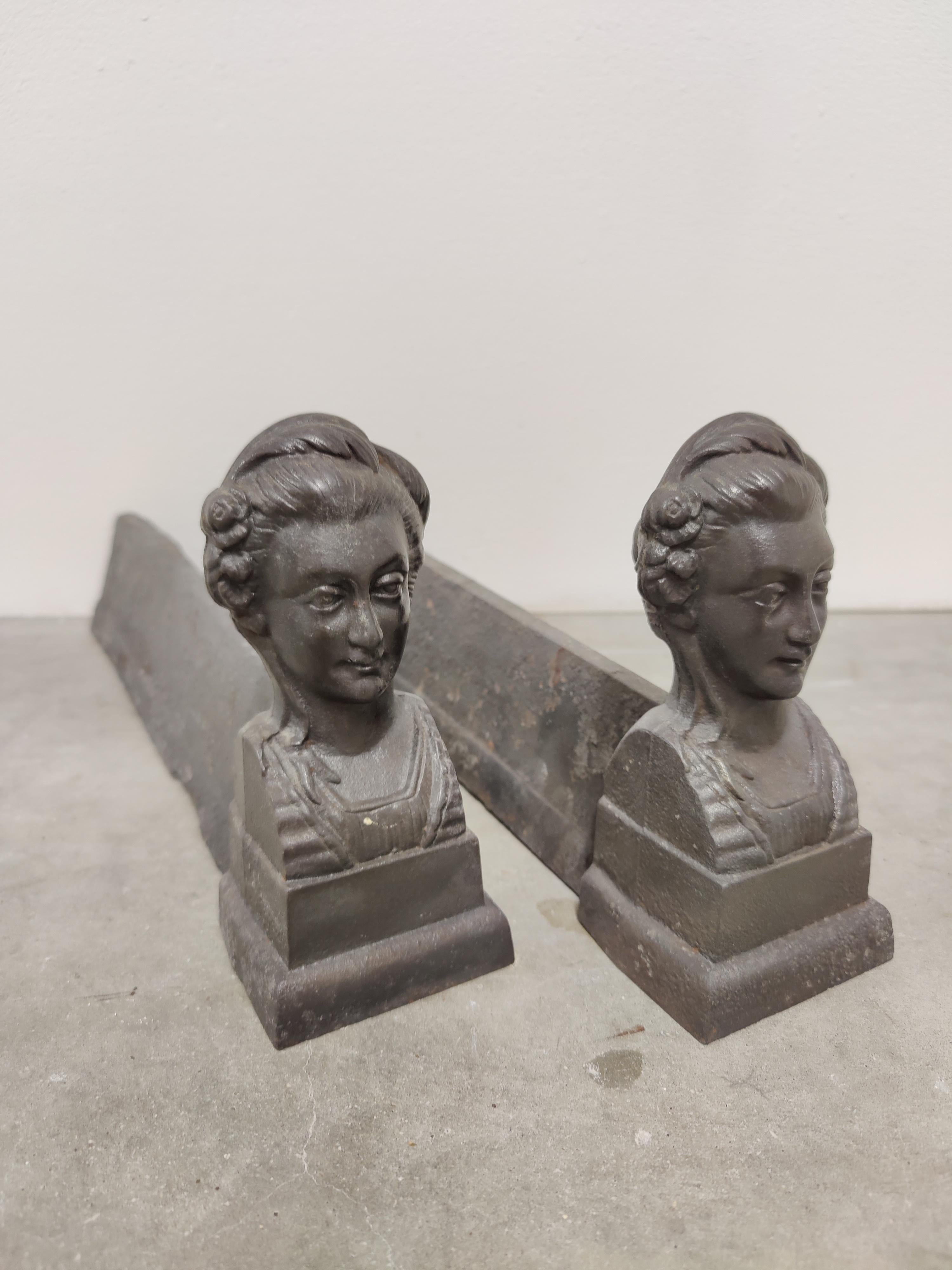 Antique andirons, showing a woman with flowers and a bun in her hair.

Weight: 9 lbs / 4 kg.

Upon request they can be made black / pewter.

