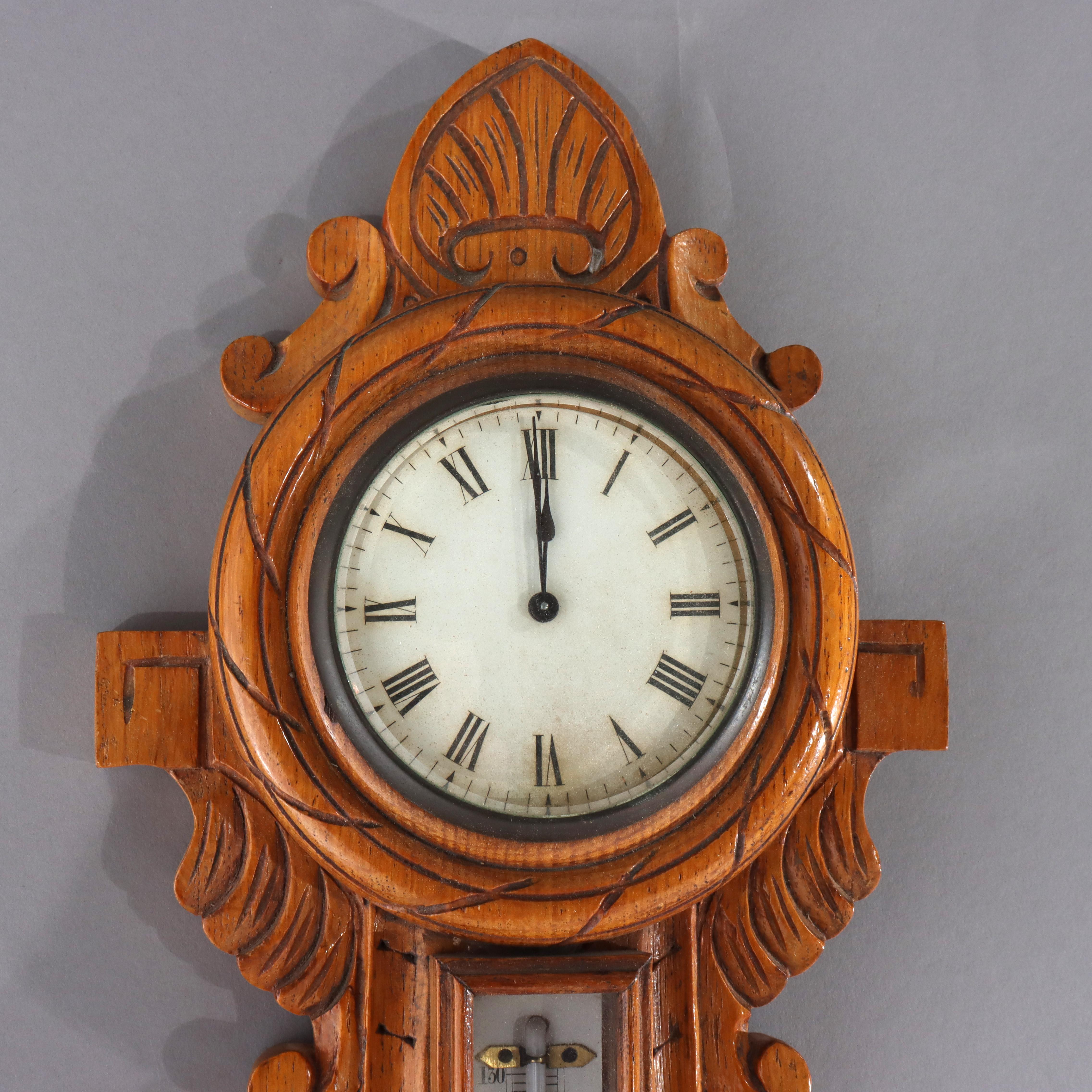 Baromètre anéroïde en chêne sculpté à thème nautique C1900.   
Dimensions - 25,5 