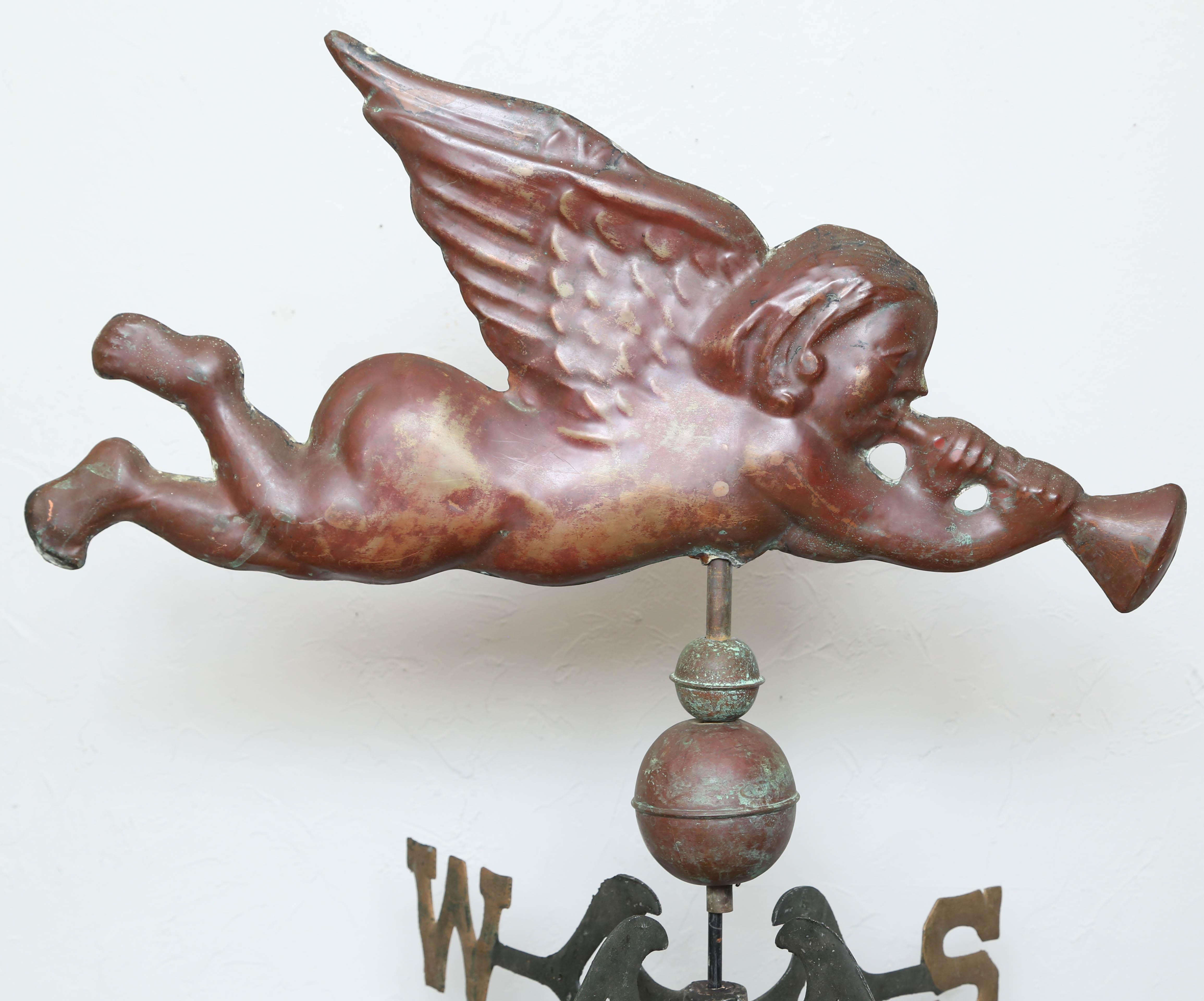 Late 19th century copper weathervane featuring an angel with Horn. Nice patina and mounted on a stand.