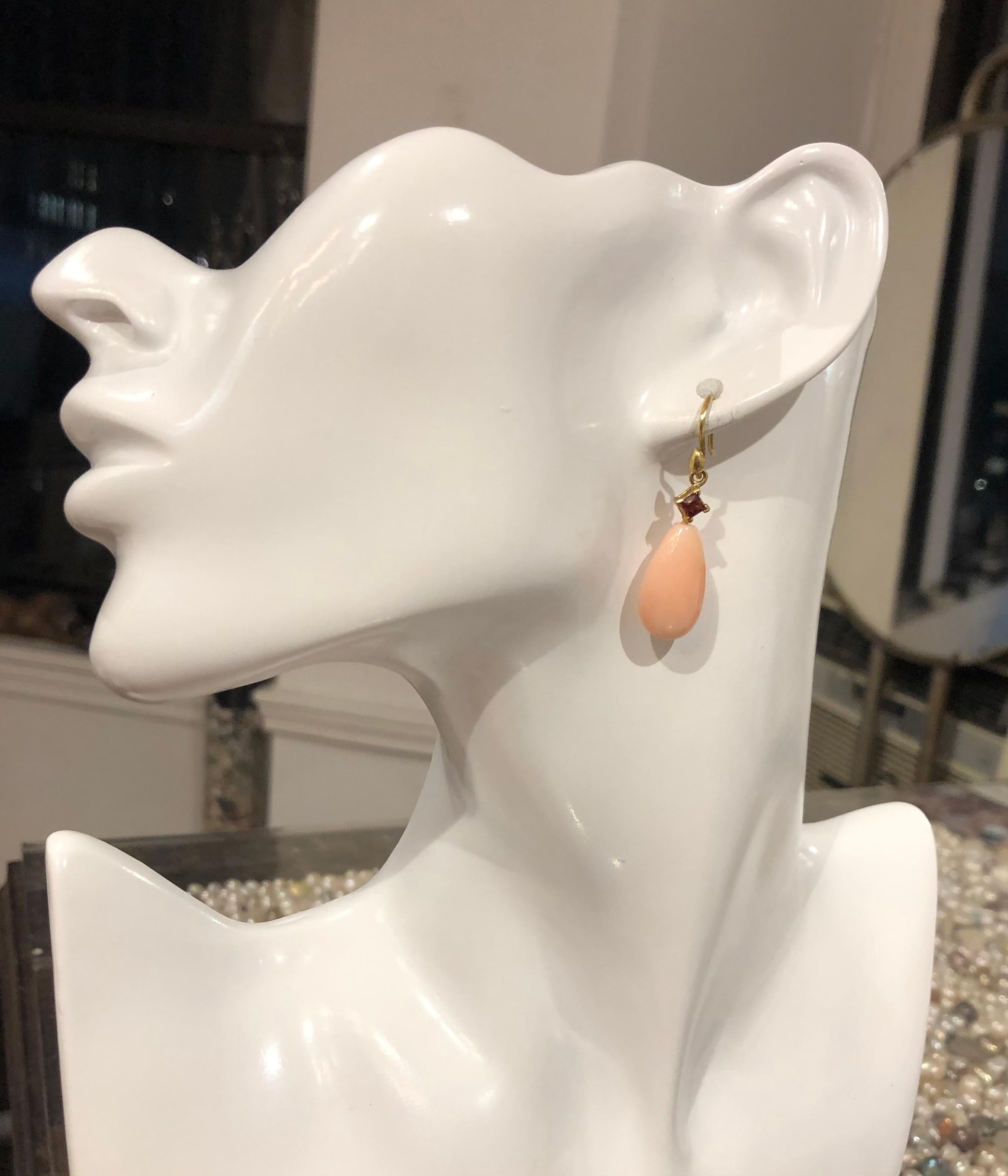 Whisper pale pure angel coral for the most feminine of jewelry looks, these teardrops are enhanced with crimson colored princess cut sapphires.

GS93CrlCrSapp — 22x12.5mm smooth antique pink coral teardrop topped with crimson princess cut sapphire,