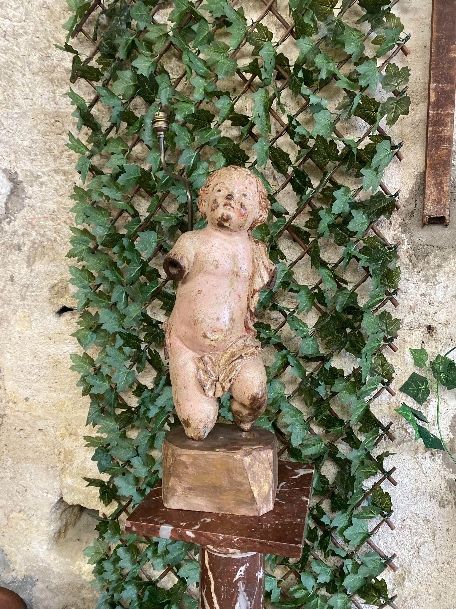 This Antique Angel Sculpture Lamp is of French Origin from the 18th century.

This Beautiful Cherub was an original church carving, later mounted as a table lamp. 

The figure is of Polychromed Wood with Beautiful Carved Details

Electric EU not
