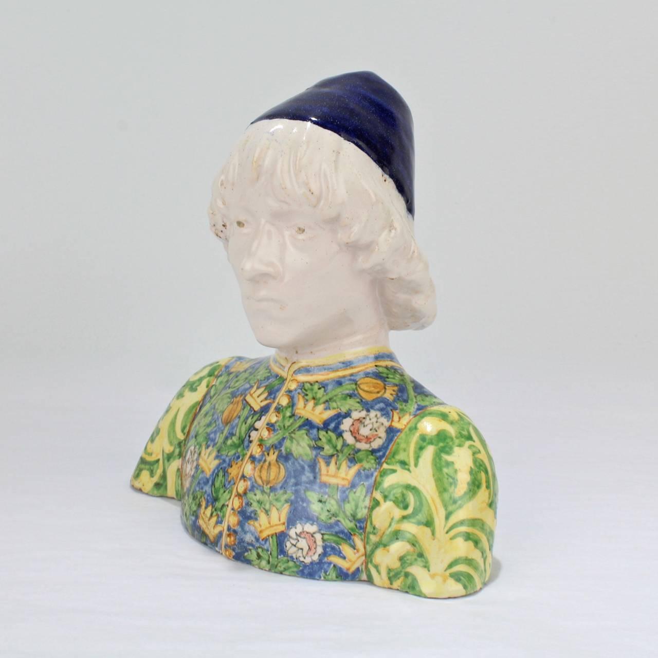 A very fine, antique Italian Maiolica bust of a Renaissance Page or Youth.

Made in the Angelo Minghetti factory in Bologna, Italy in the late 19th or early 20th century.

Angelo Minghetti started producing ceramics at Imola in 1848. He started