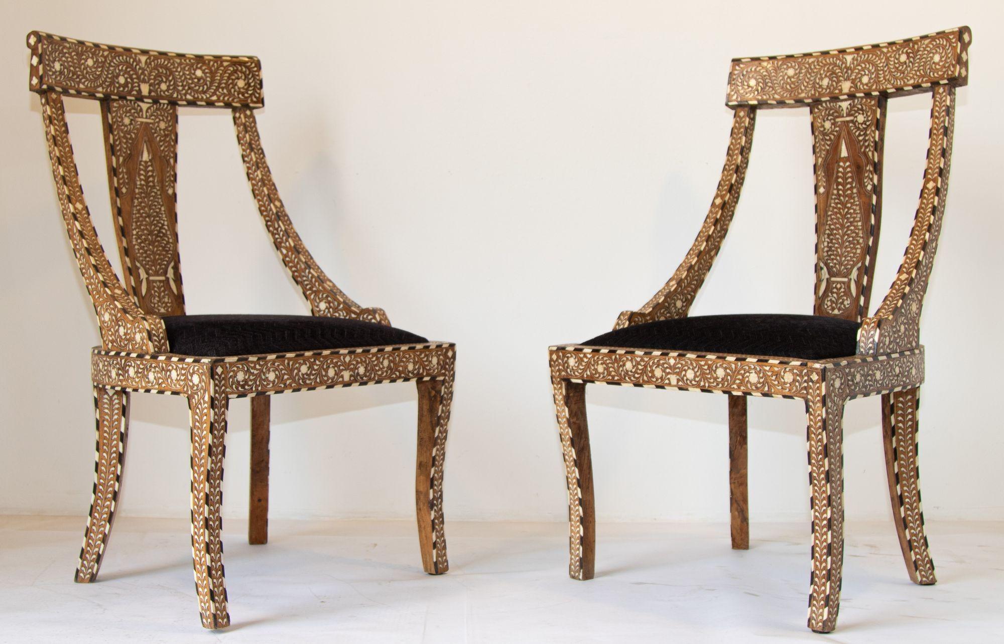 Antique Anglo Indian sheesham wood chairs with bone inlay floral pattern throughout.
Beautiful sheesham wood side chairs or dining chairs with bone inlays, handmade in India.
Bone inlay is an ancient decorative technique that involves embedding