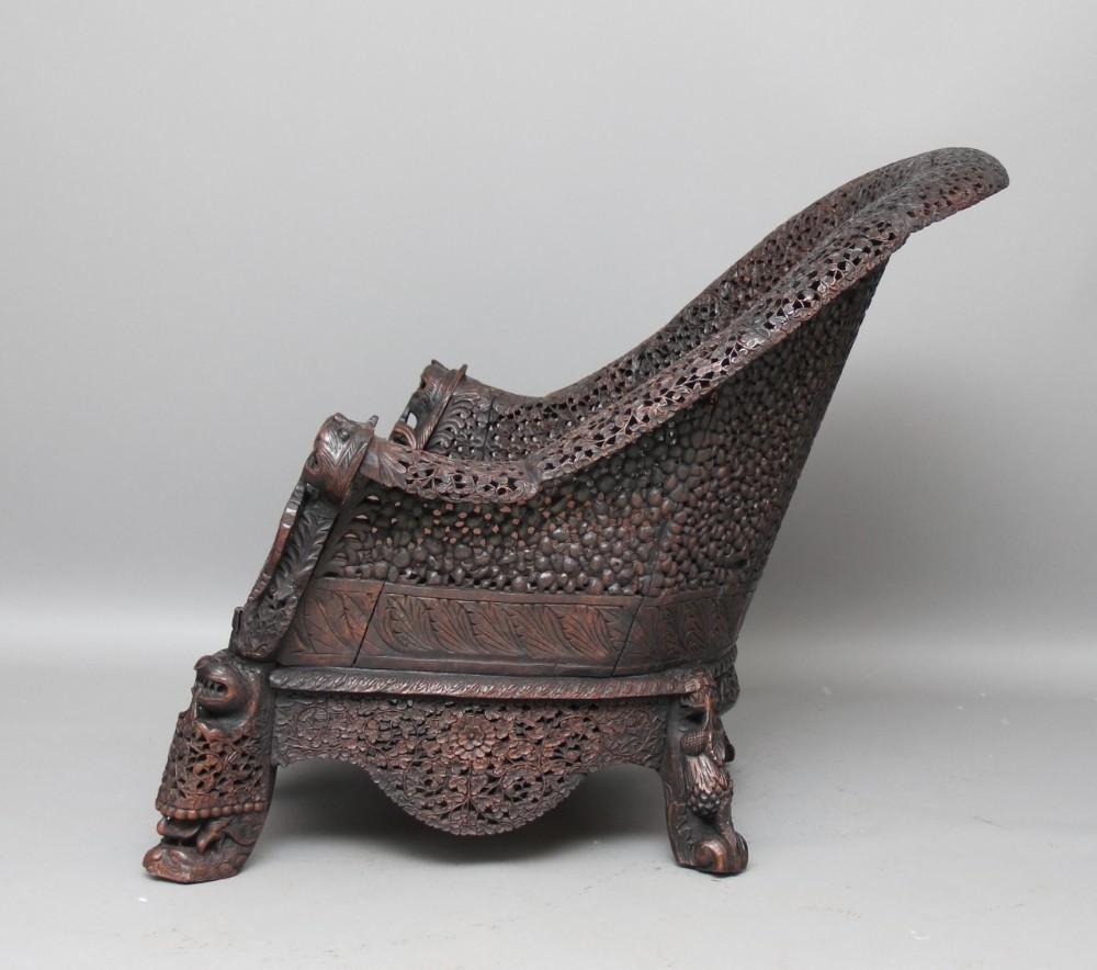 Fine Antique Anglo Indian/ Burmese Chair Profusely Hand Carved 
Decoration 19th Century

This antique Burmese chair boasts exquisite profusely carved decoration that is sure to add a touch of elegance to any space. 
The chair is a true piece of
