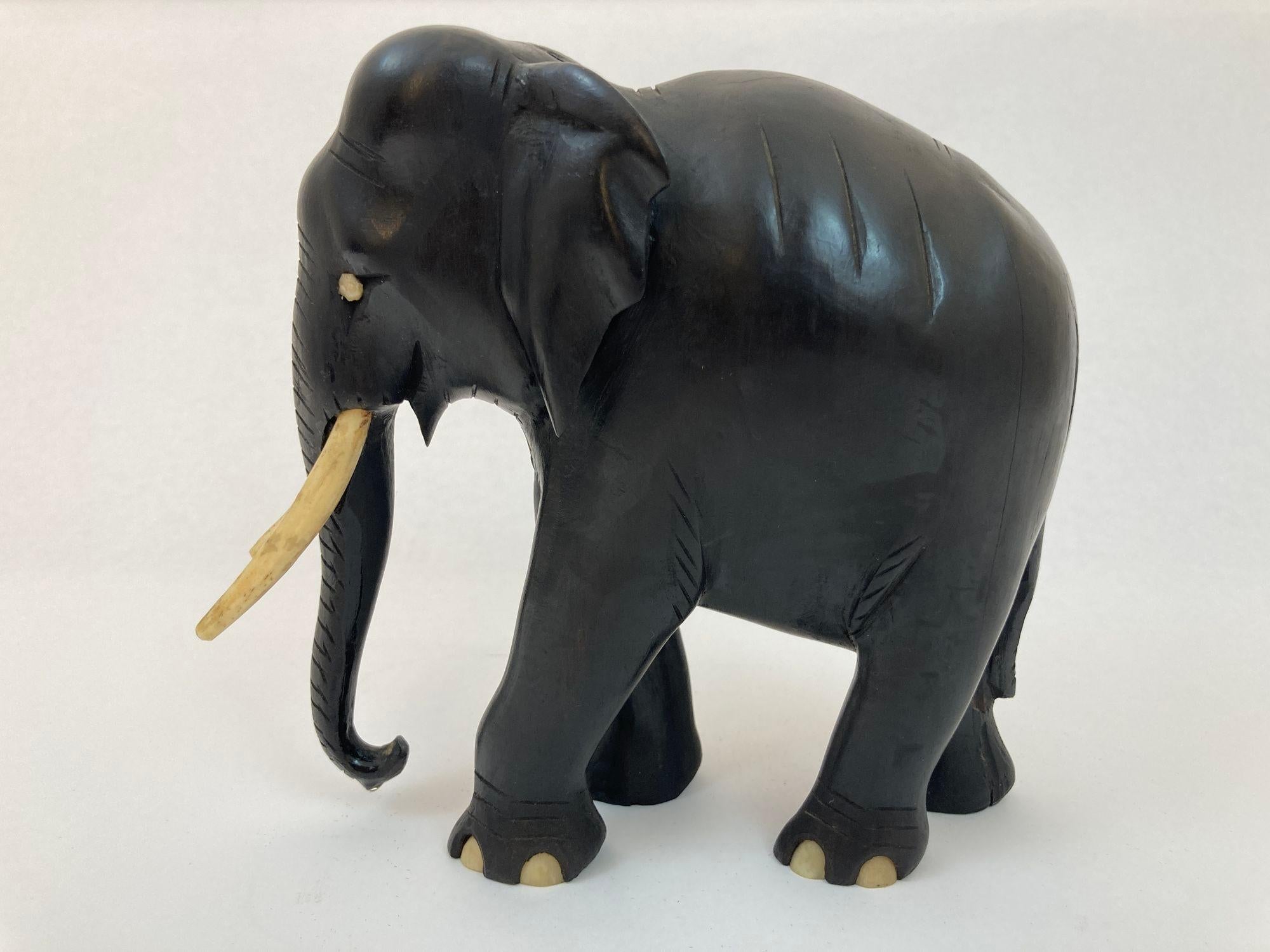 Antique Black Ebonized Wood Hand Carved Anglo Indian Elephant Sculpture.
Precious black ebonized hand carved wood Anglo-Indian elephant sculpture.
This is a hand carved ebony wood lucky elephant from Ceylon Sri Lanka.
Beautifully hand carved animal