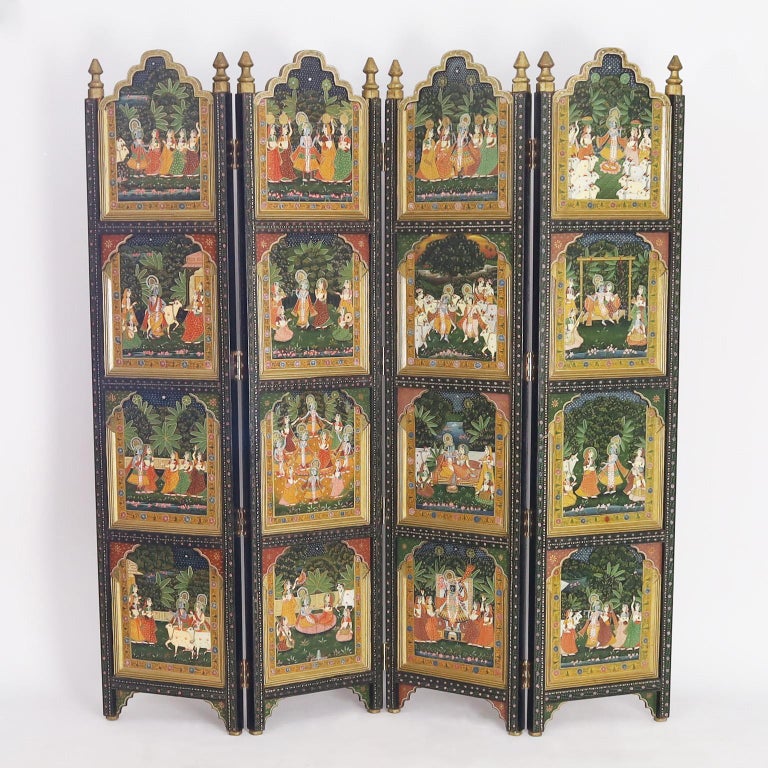 Enchanting antique Anglo Indian four panel screen or room divider crafted in indigenous hardwood featuring no less than thirty two hand painted panels depicting the lives of the rich and famous.