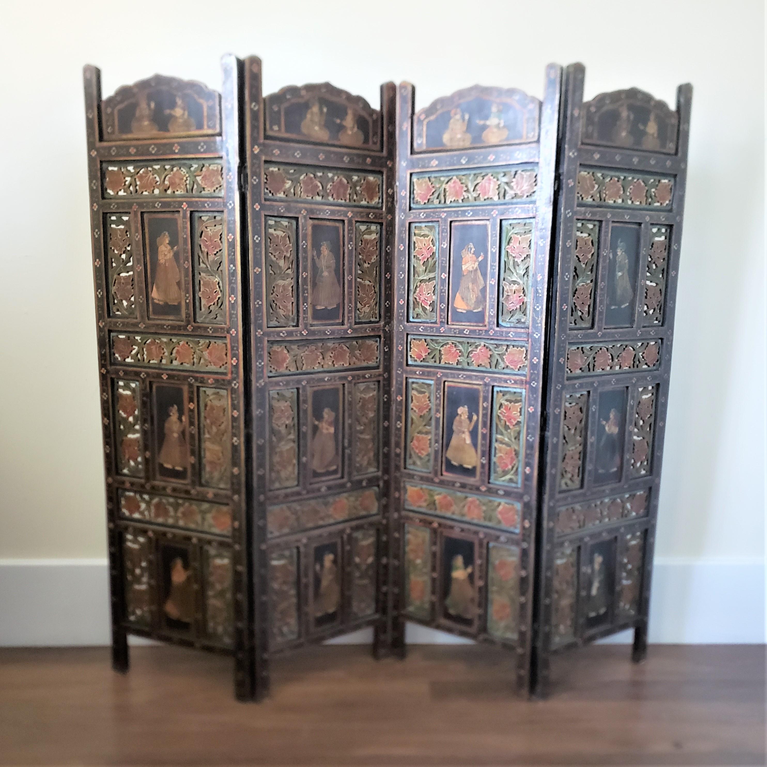 This four hinged panel screen or room divider has no maker's label or signature, but is presumed to have originated from India and date to approximately 1900 and done in the period Anglo-Indian style. The panels are composed of a softwood with inset