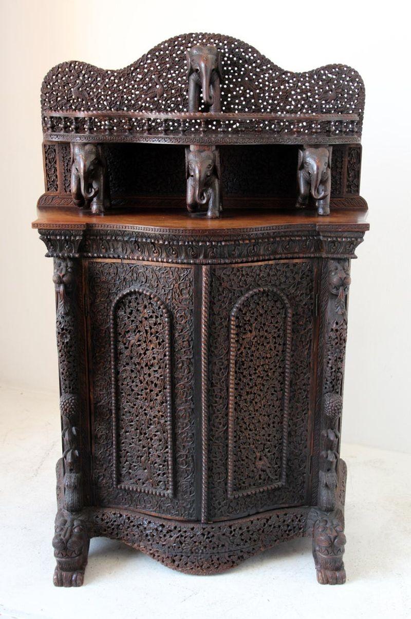 Antique Anglo Indian cabinet, side board or dry bar.
An intricately-carved Anglo-Indian rosewood cabinet with all-over flower and foliate and elephants sculptures design.
A superb quality mid 19th century finely hand-carved Anglo - Indian