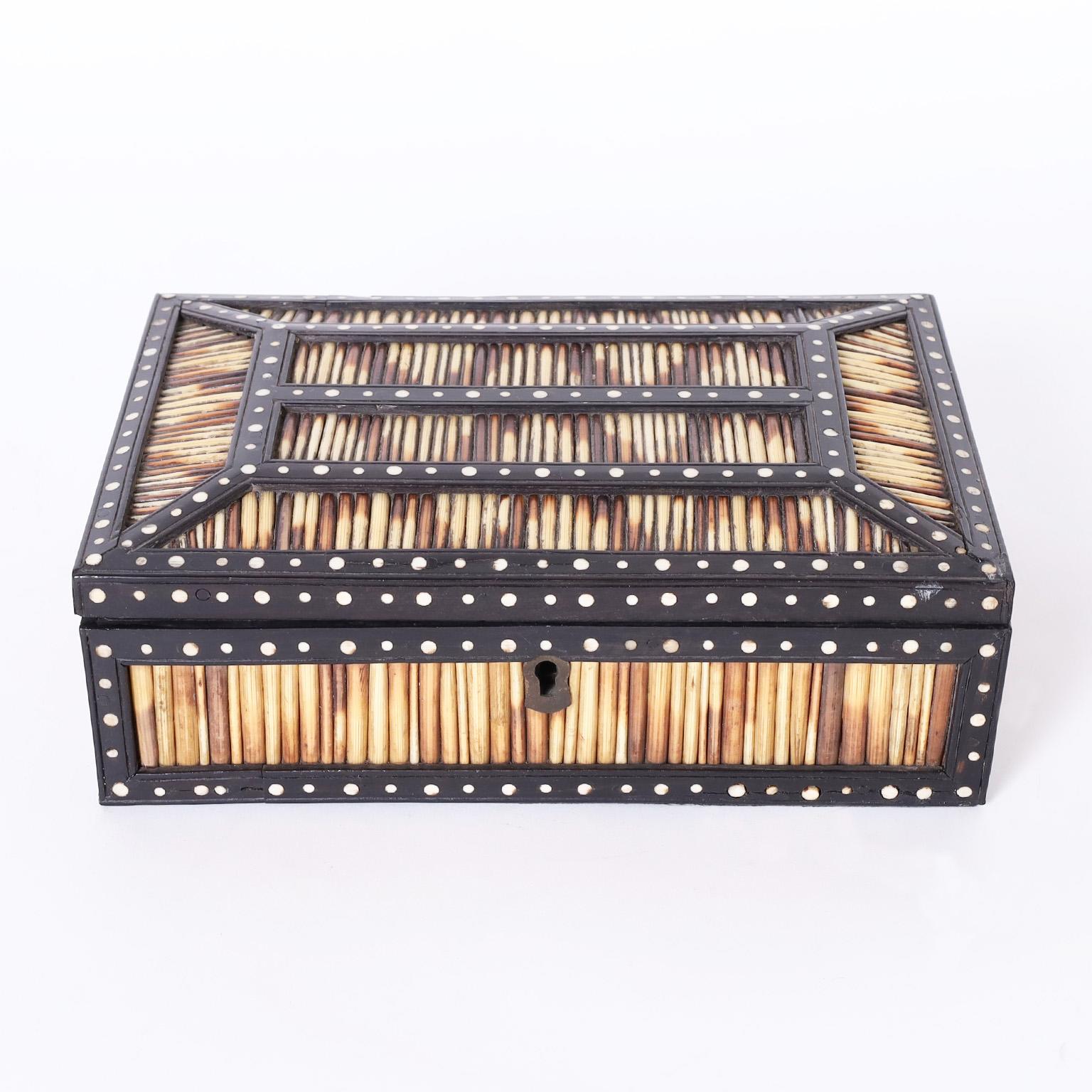 Anglo Indian antique lidded box crafted in indigenous hardwood decorated in porcupine quills and bone dots inside and out.