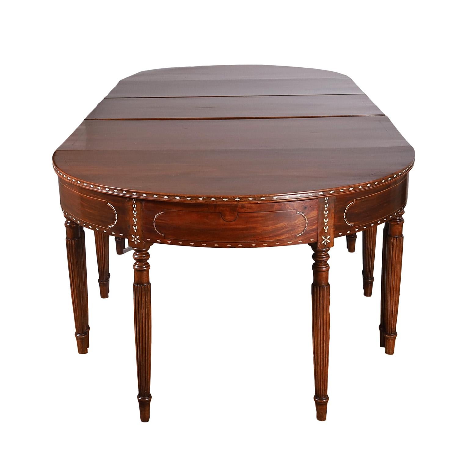 Rare and unusual antique Anglo Indian style dining table composed of five pieces of furniture crafted in mahogany with floral bone inlays and turned & beaded legs. All five pieces can be used separately or together in any combination. Often mistaken
