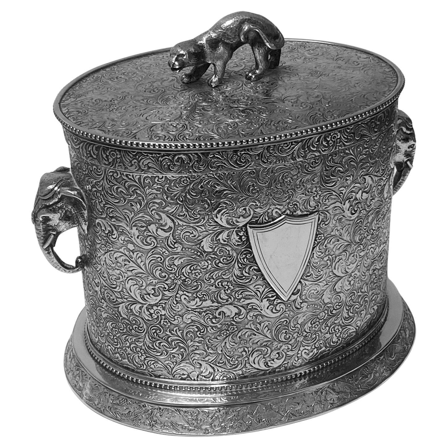 Antique Anglo-Indian style large biscuit box, silber & Fleming C. 1880. This very unusual style large biscuit barrel of ovoid shape on oval base richly decorated and engraved depicting birds amongst flowering branches against stippled background and