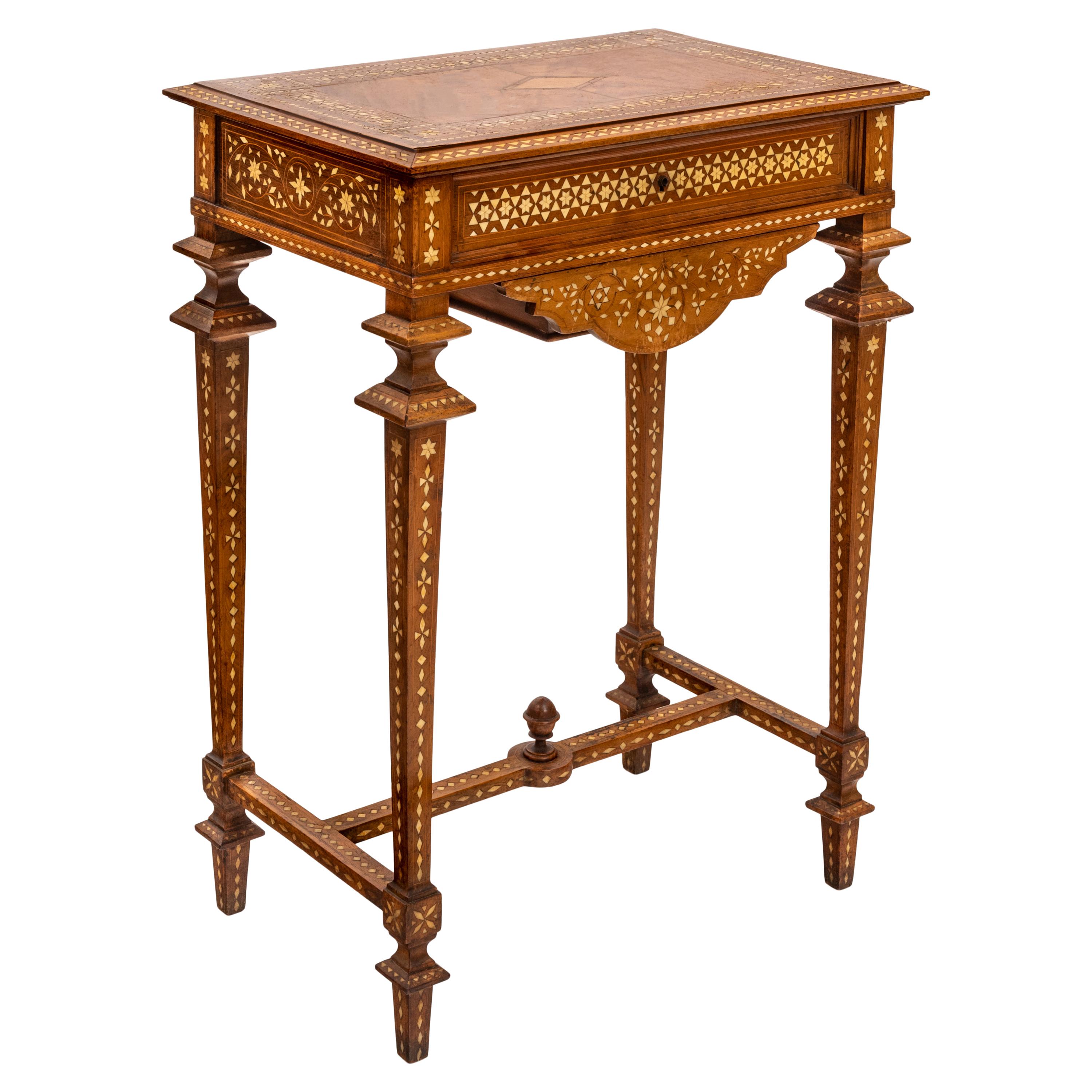 A good antique Anglo-Indian inlaid marquetry side /work table, circa 1870.
This very elegant antique table is profusely inlaid with geometric bone marquetry and exotic hardwood inlay. The rectangular top inlaid with rosewood stringing, mahogany and