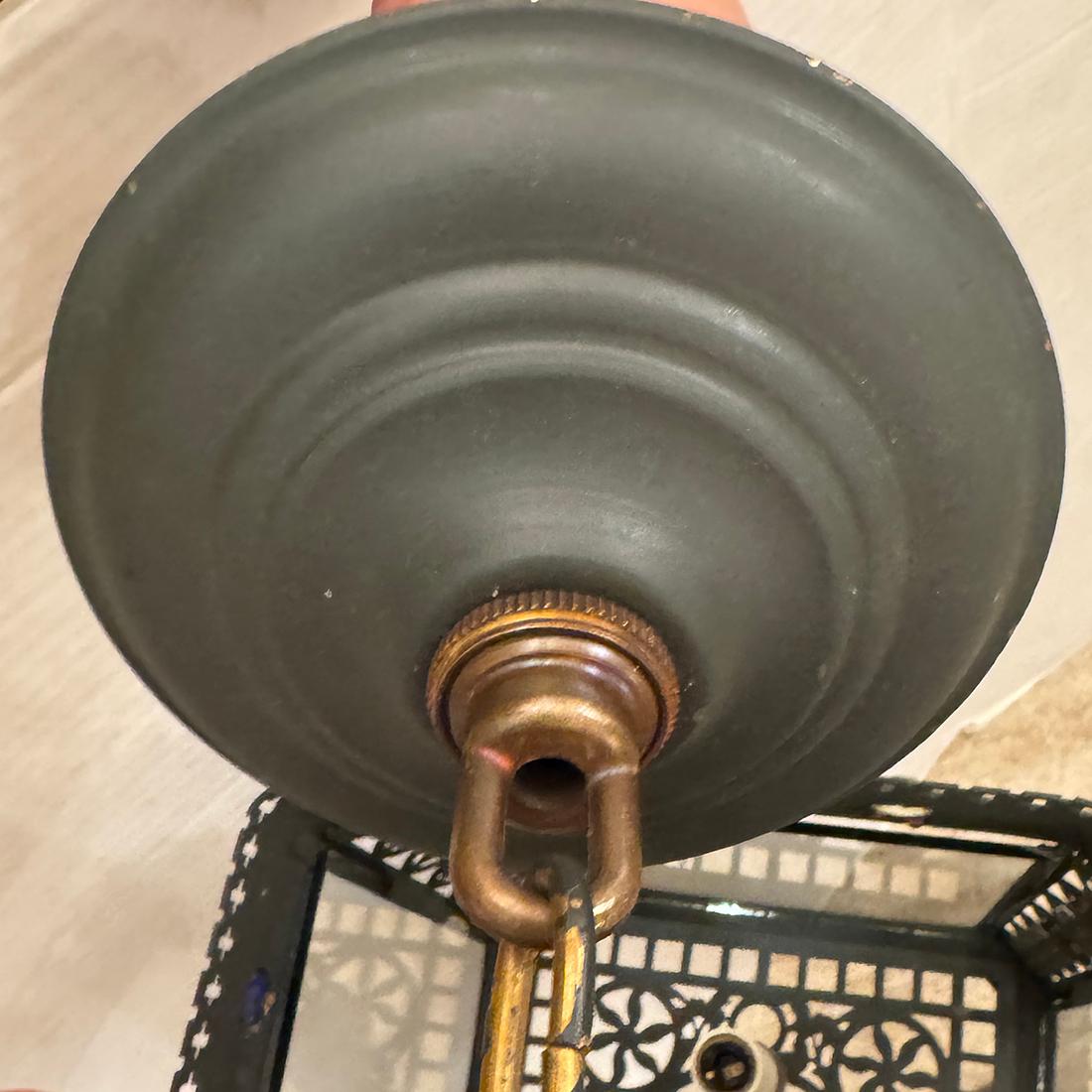 A circa 1900's English patinated bronze lantern with glass jewels and 4 candelabra lights.

Measurements:
Drop: 24.5