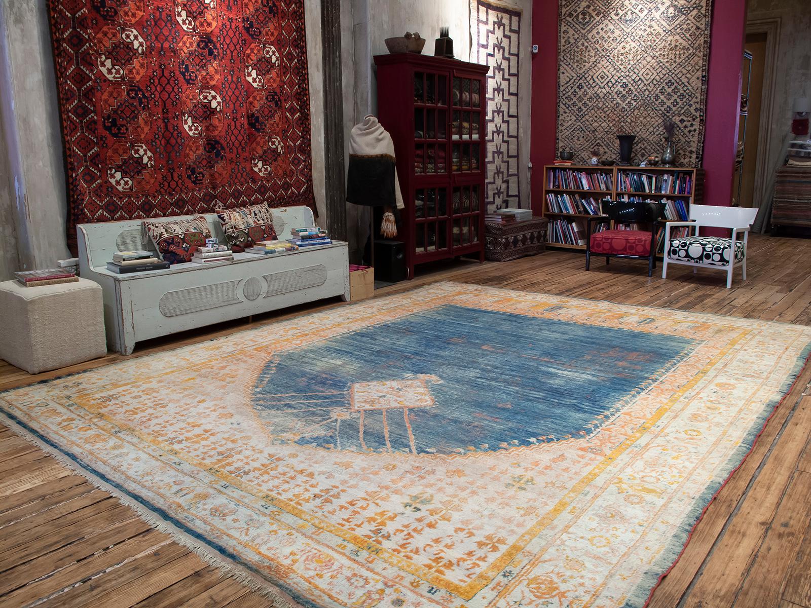 A luxurious example from the prolific looms of the Oushak region in Western Turkey, with brilliant colors, woven in shiny angora (mohair), the hair of the local angora goats. The design is inspired by prayer rugs, enlarged to represent a heavenly