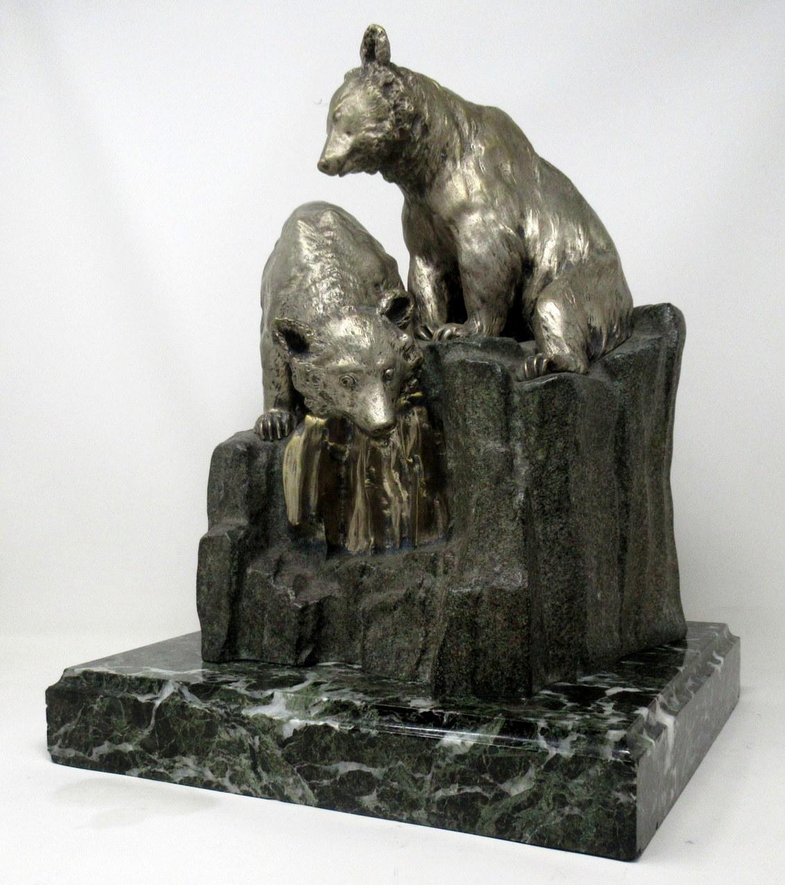A very impressive large silvered French bronze animal group supported on its original green marble stepped base which is unattached, first quarter of the 20th century. 
Depicts two wild bears on top of a cascading naturalistic rock.
Signature of