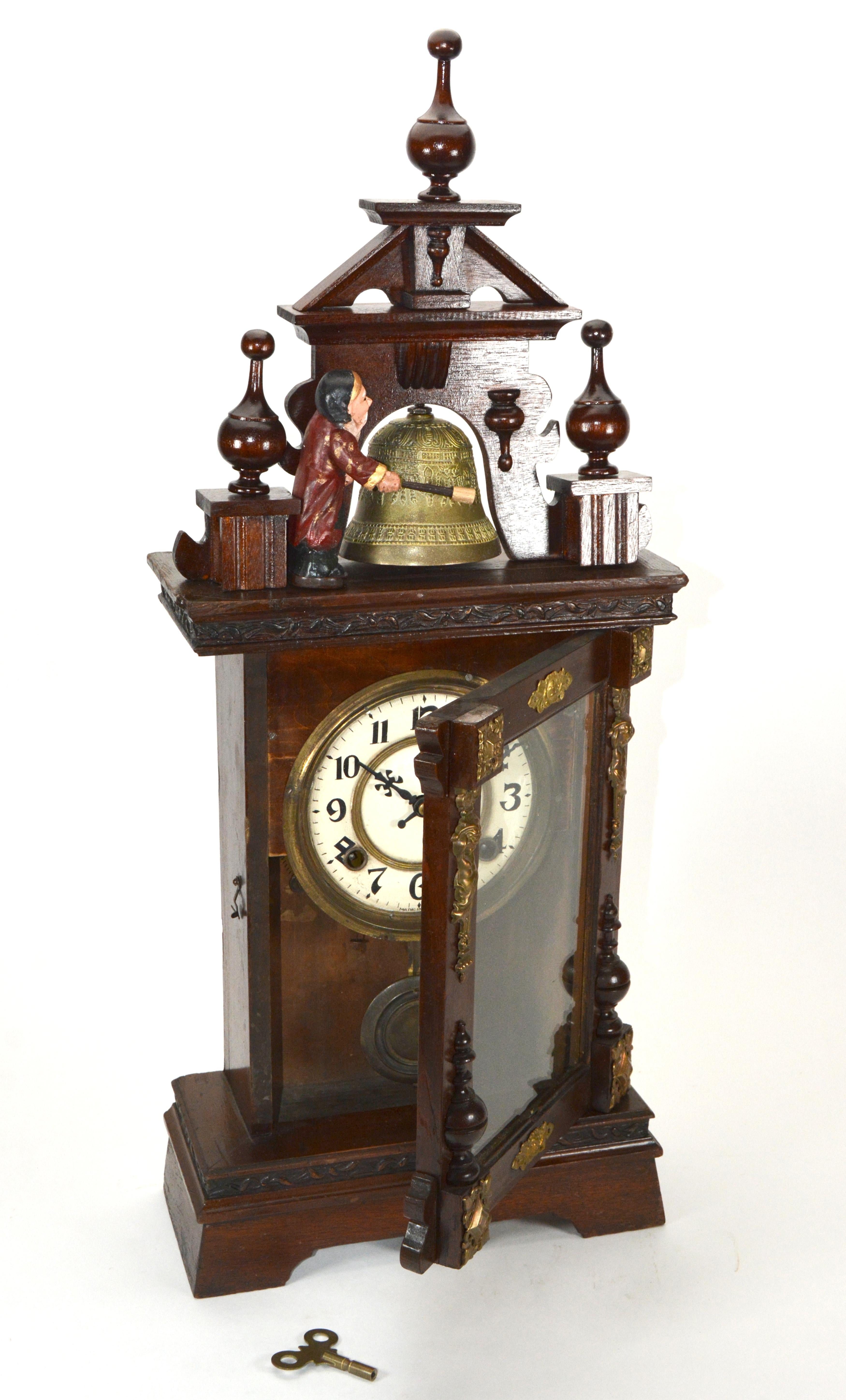 Antique Animated Monk Striking Bell 3 Finial Brass Decorated 8 Day Mantle Clock

MOVEMENT: 8 day wind up mechanism

FUNCTION: time with half hour and hour striking

SIZE: 28