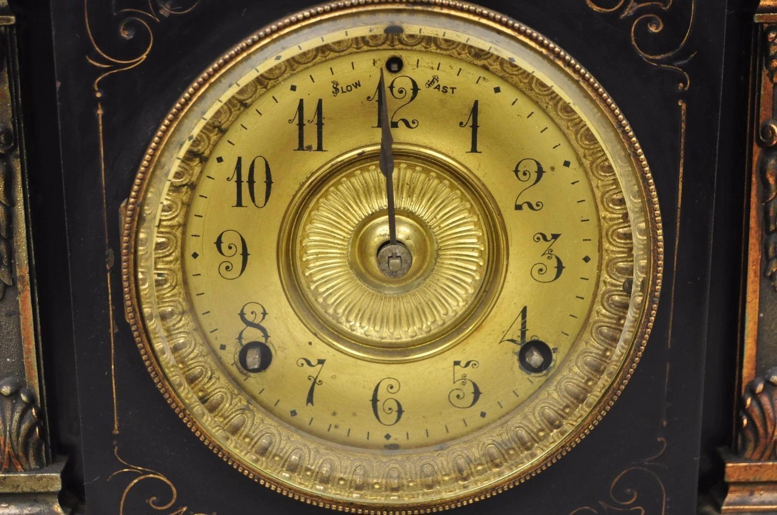 Cast Antique Ansonia Black Mantel Clock with Bronze Coated Columns and Claw Feet For Sale