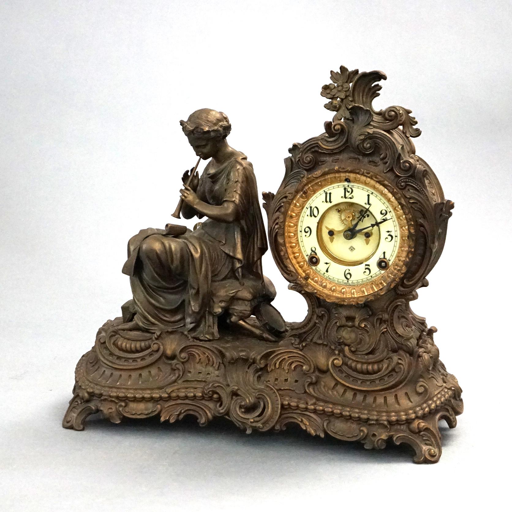 Antique Ansonia Bronzed Metal Figural Mantel Clock with Sculpture of a Classical Woman Playing Flute, C1890

Measures - 14.5