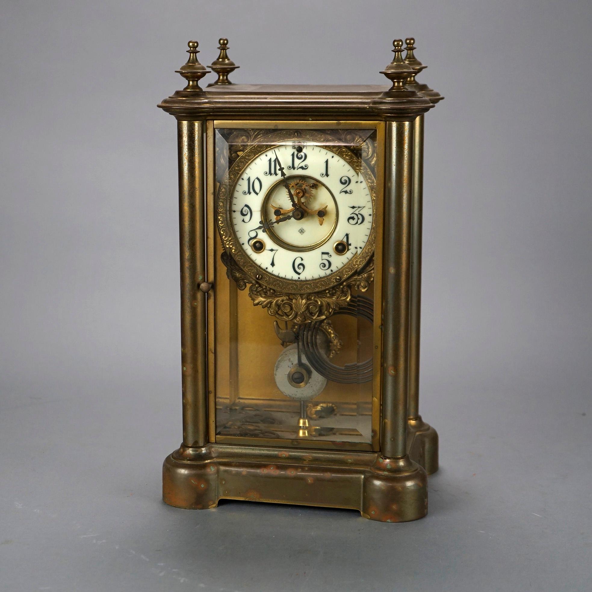 An antique crystal regulator mantle clock by Ansonia, maker mark on face as photographed, c1900

Measures- 15.25''H x 8.5''W x 7''D.