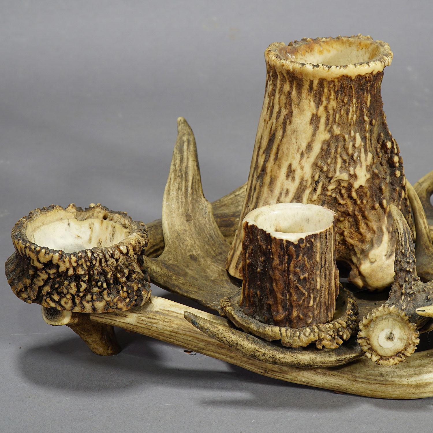 The  antique antler smoking desk set is made of original antlers from the deer and the stag. It was in Germany, circa 1900.

Measures: Width 16.93