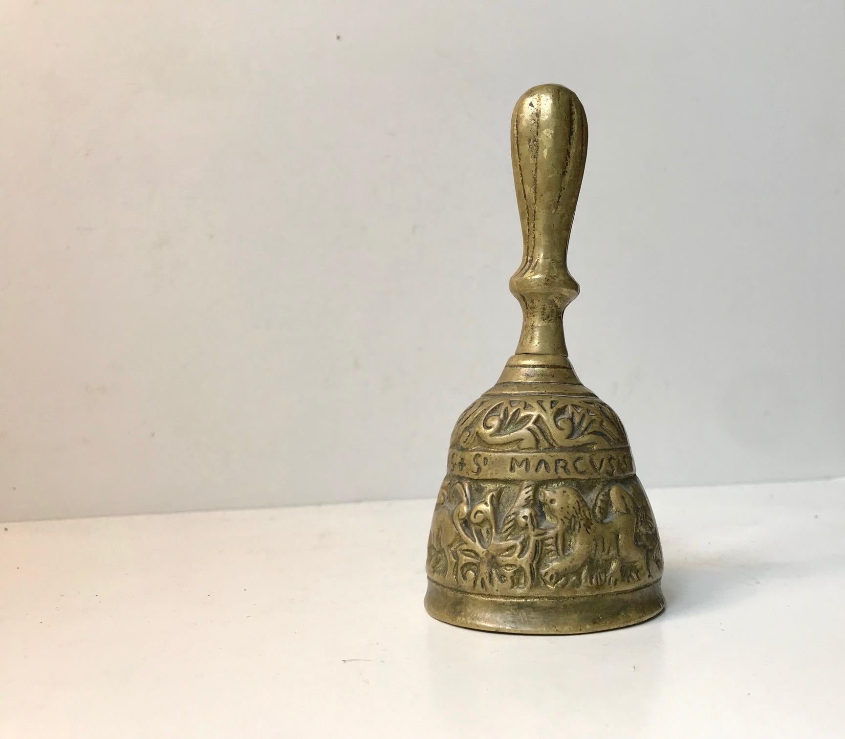Ancient looking Apostle hand/table/servant bell with figurines and the names of the 4 Evangelist's: Matheus, Marcus, Lucas, and Johannes. This bell has been copied a lot so despite having the right handle type and patina to the brass we are