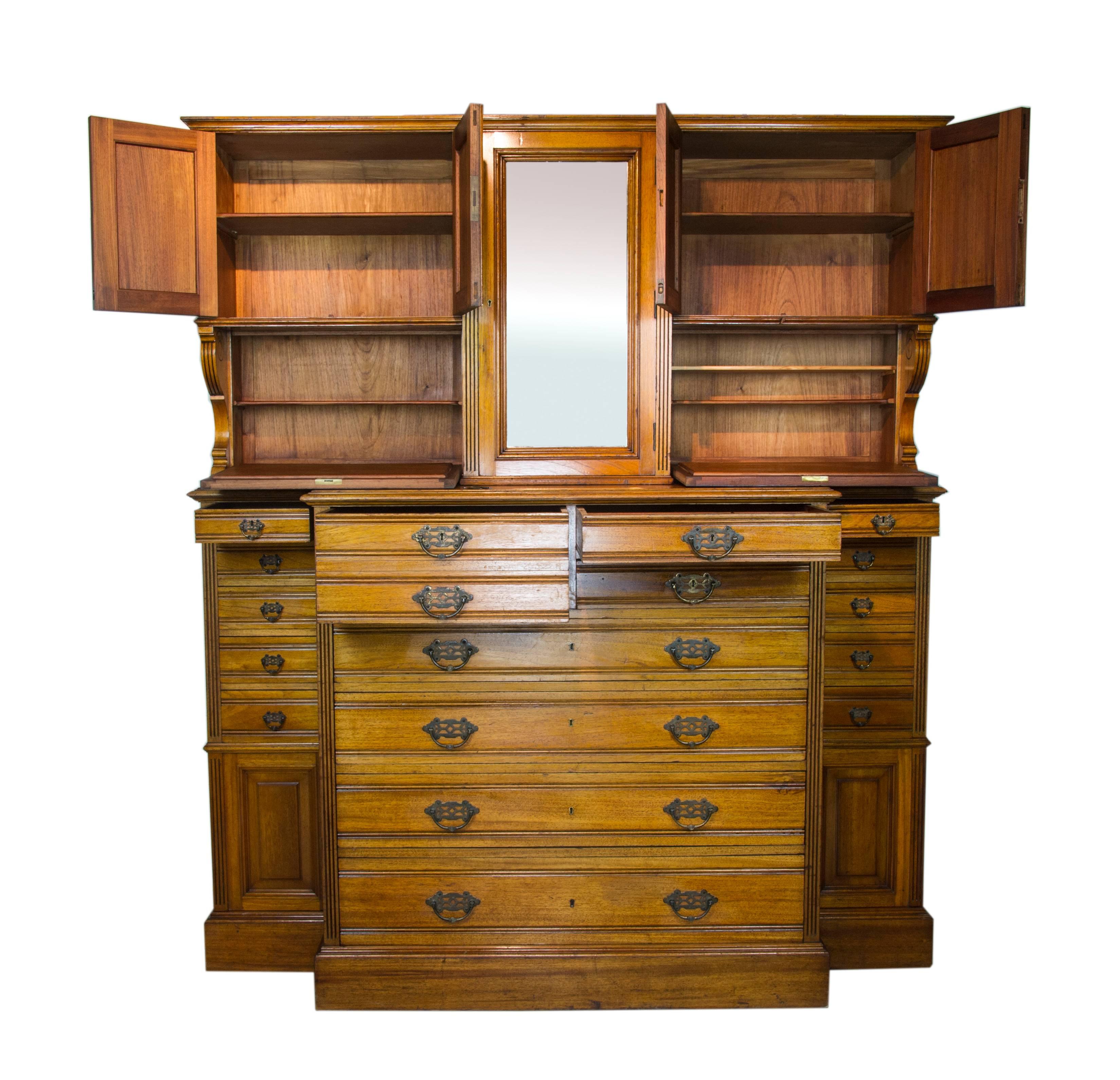 Antique apothecary cabinet, antique dentist cabinet, solid walnut, antique furniture, B1061

Scotland, 1870
Solid walnut construction
Original finish
Crisp moulded cornice above
Central beveled mirror door with interior shelving
Flanked by four